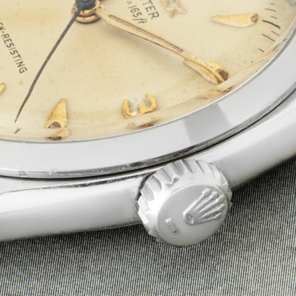A rare vintage stainless steel Rolex Oyster Shock Resisting Ref 6484 manual wind movement wristwatch. Featuring the very rare 50 meters well aged silver dial with applied dagger style hour markers, applied arabic numbers 3,6 and 9.

Complemented