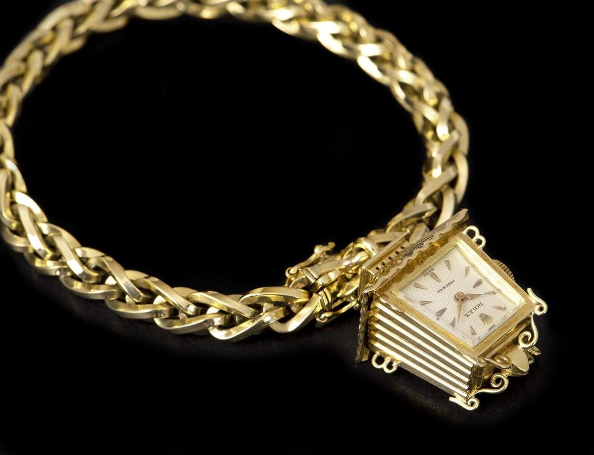 A Rare 18k Yellow Gold Precision Lantern Vintage Ladies Wristwatch, silver dial with applied hour markers, a fixed 18k yellow gold bezel, an 18k yellow gold jewellery style bracelet with a concealed 18k yellow gold jewellery style clasp, mineral