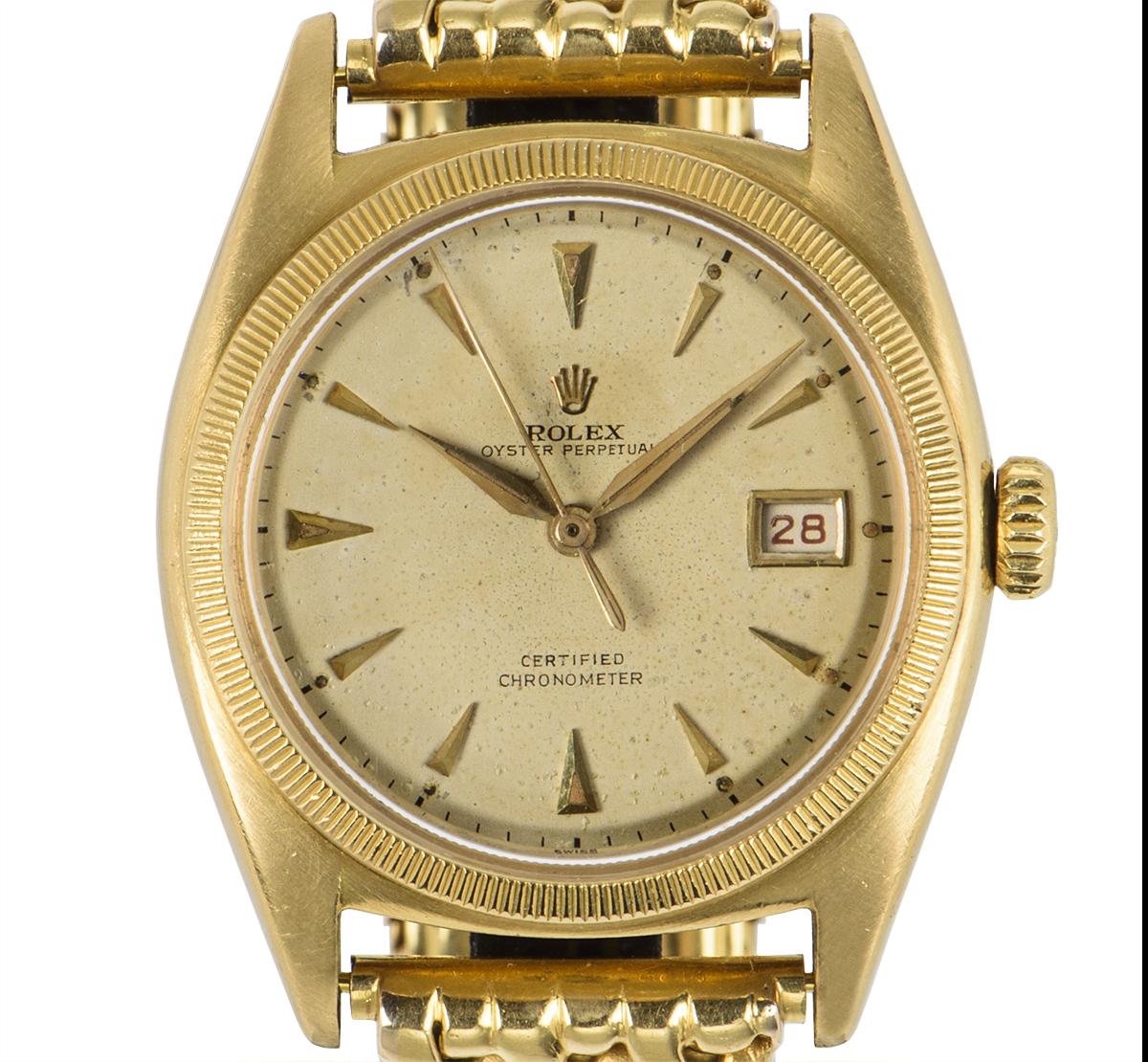 A Rare 18k Yellow Gold Semi Bubble Back Oyster Perpetual Vintage Men's Wristwatch, silver dial with applied hour markers, a fixed 18k yellow gold coin edge bezel, a very rare original 18k yellow gold bracelet with an original 18k yellow gold
