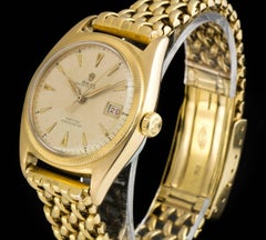 Montre Rolex rare vintage à lunette semi-bulle à bord en forme de pièce de monnaie Oyster Perpetual