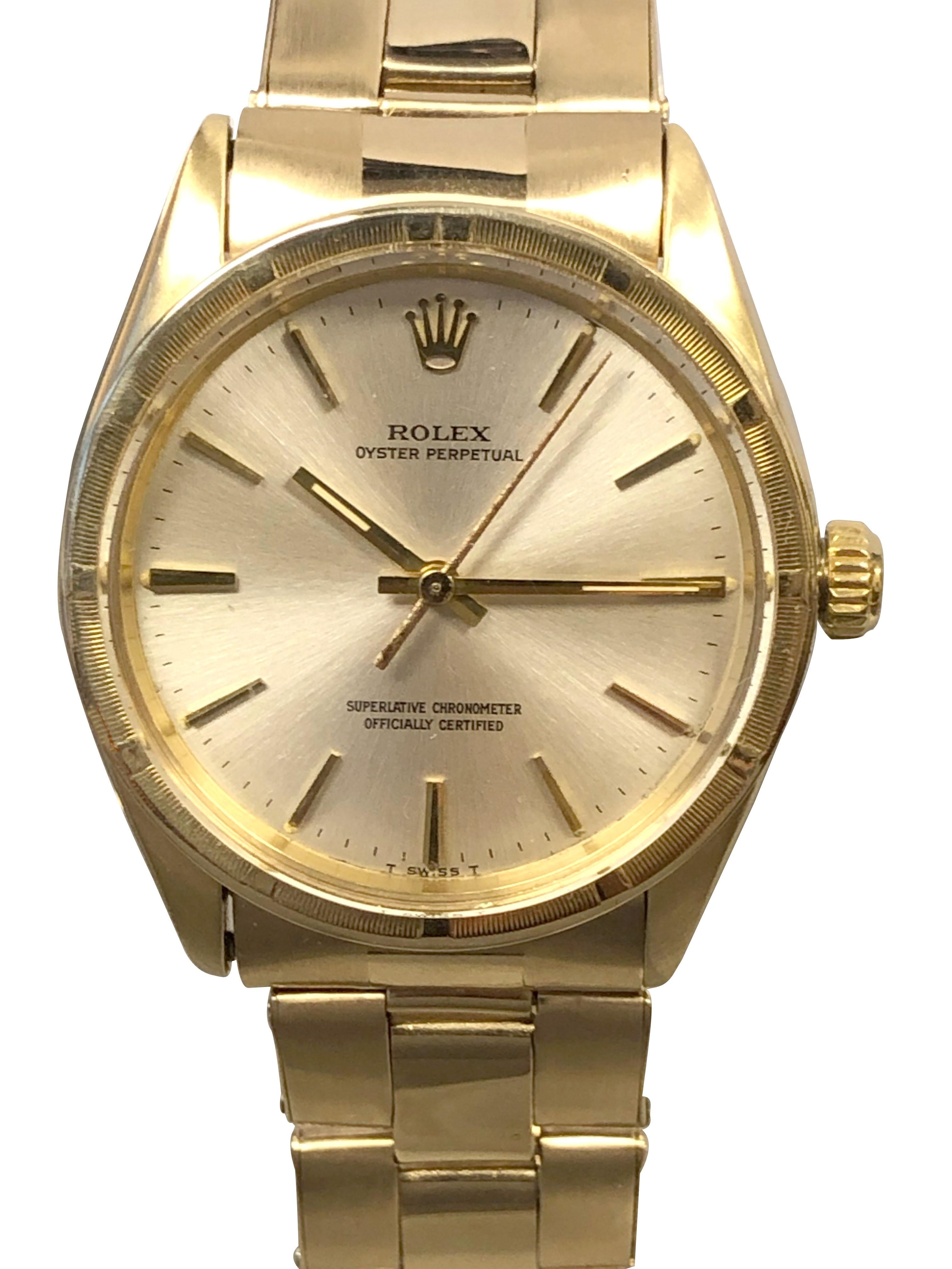 Circa 1970 Rolex Reference 1007 Wrist Watch, 34 M.M. 14k Yellow Gold 3 Piece Oyster case. Engine turned bezel, original and mint condition Silver Satin  dial with raised Gold stick markers and a sweep seconds hand, caliber 1560 Automatic, self