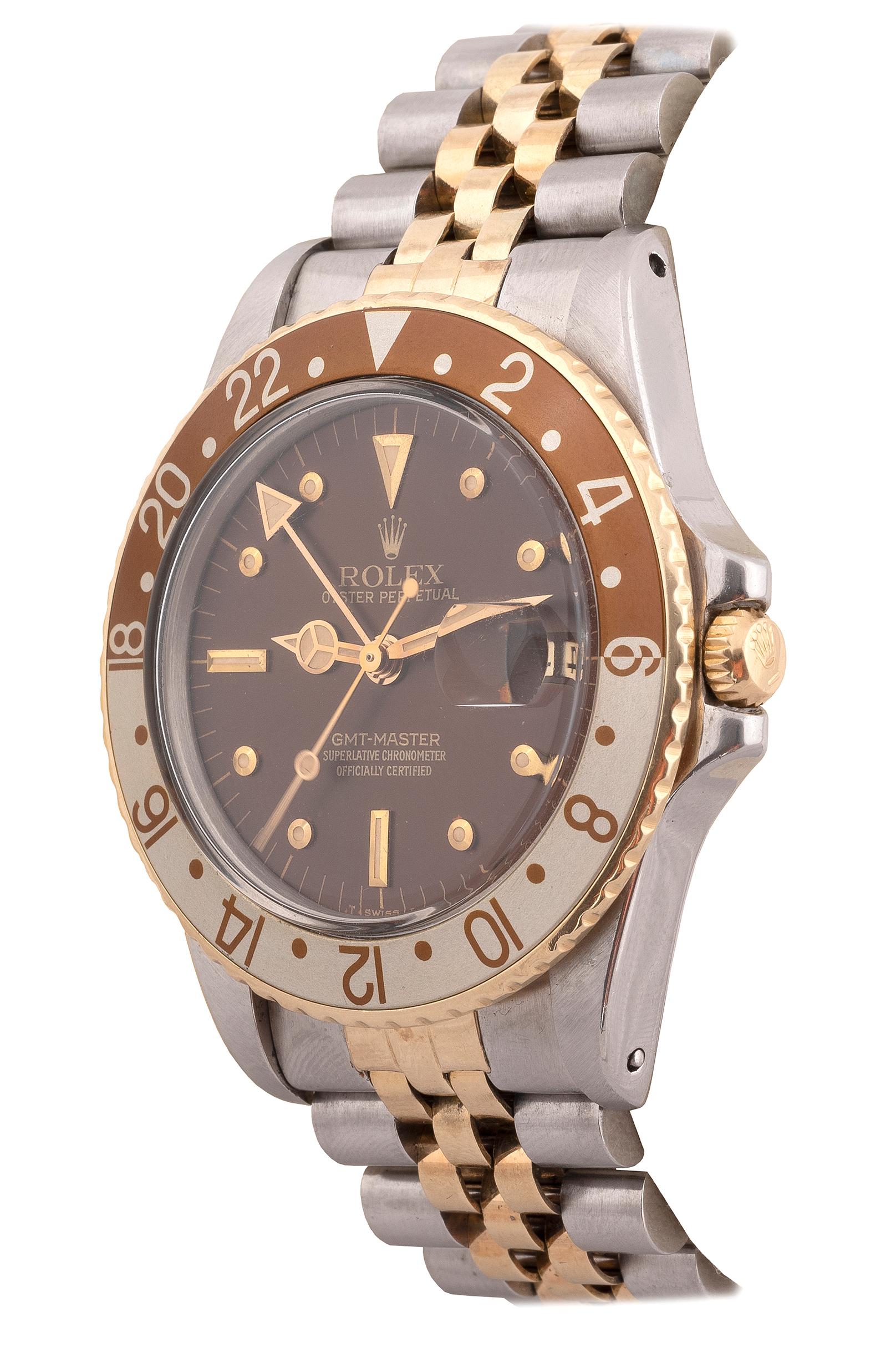 Made in 1980. Very fine, two time zone, center seconds, self-winding, water-resistant, stainless steel and 18K yellow gold Chronometer wristwatch with date, 24-hour bezel and hand and a stainless steel and 18K yellow gold Rolex Jubilee bracelet with