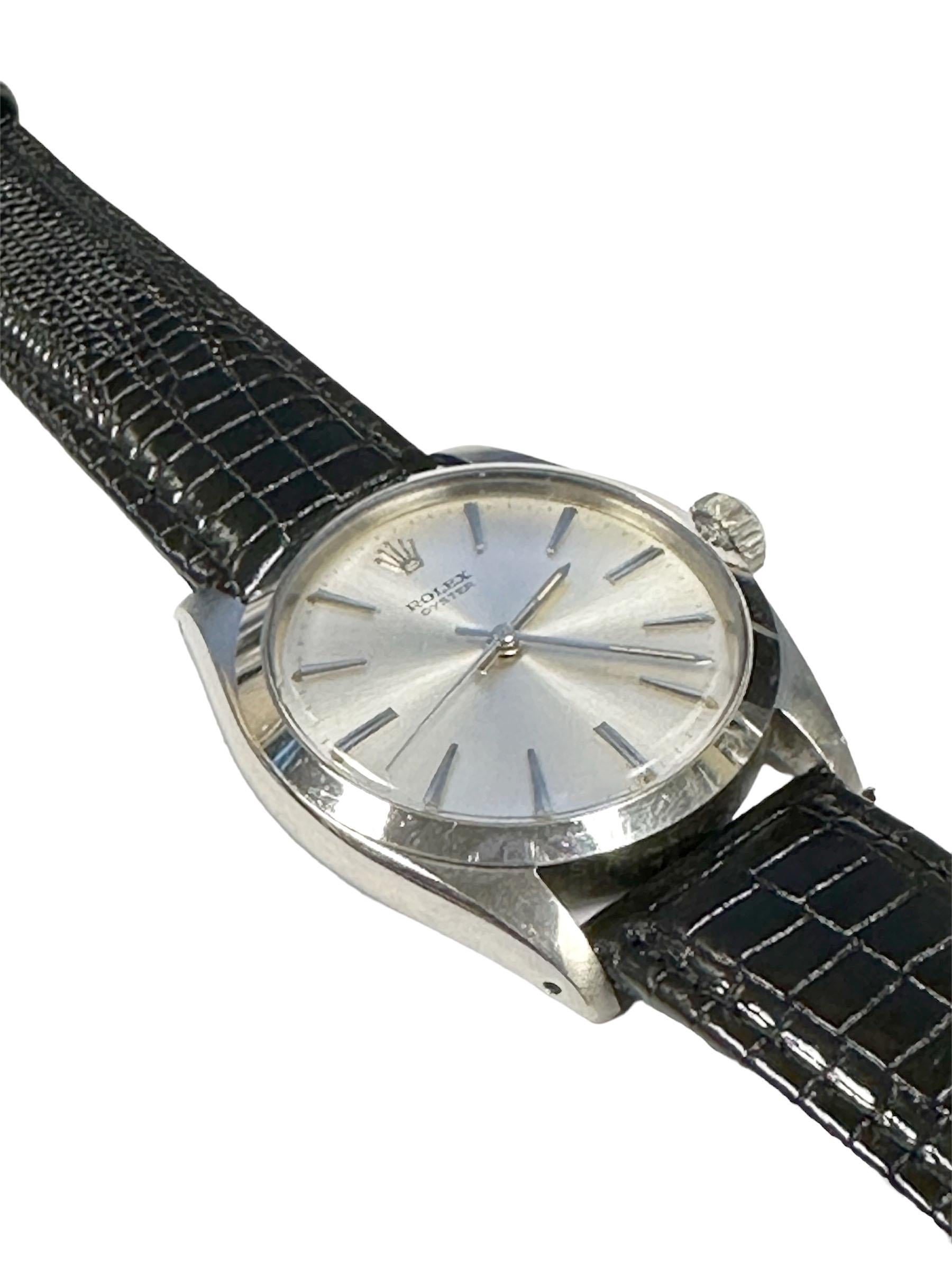 Circa 1959 Rolex Reference 6426 Wrist Watch, 34 M.M. Stainless Steel 3 Piece Oyster Case, 17 Jewel Caliber 1210 Manual Wind Nickle Lever Movement, Beautiful Original Mint Condition Silver Satin Dial with the shiny Rainbow effect, having Raised