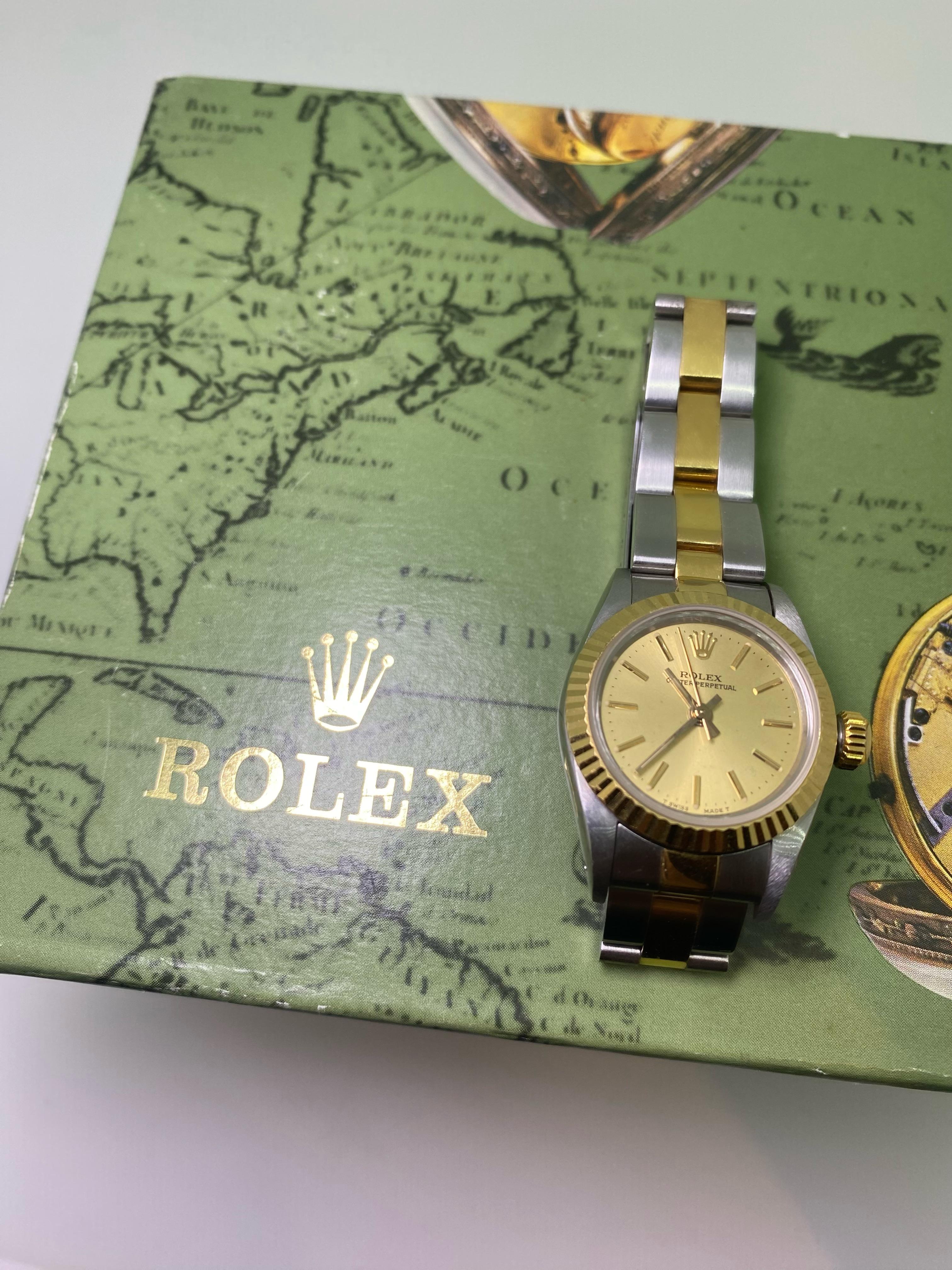 Of timeless design, 
this two-tone gold & steel elegant Rolex Oyster Perpetual ref 67000 
is in mint condition & in excellent working order, 
dating from 1990's.

The timepiece features:
an eternally popular & highly desirable Champagne Dial,