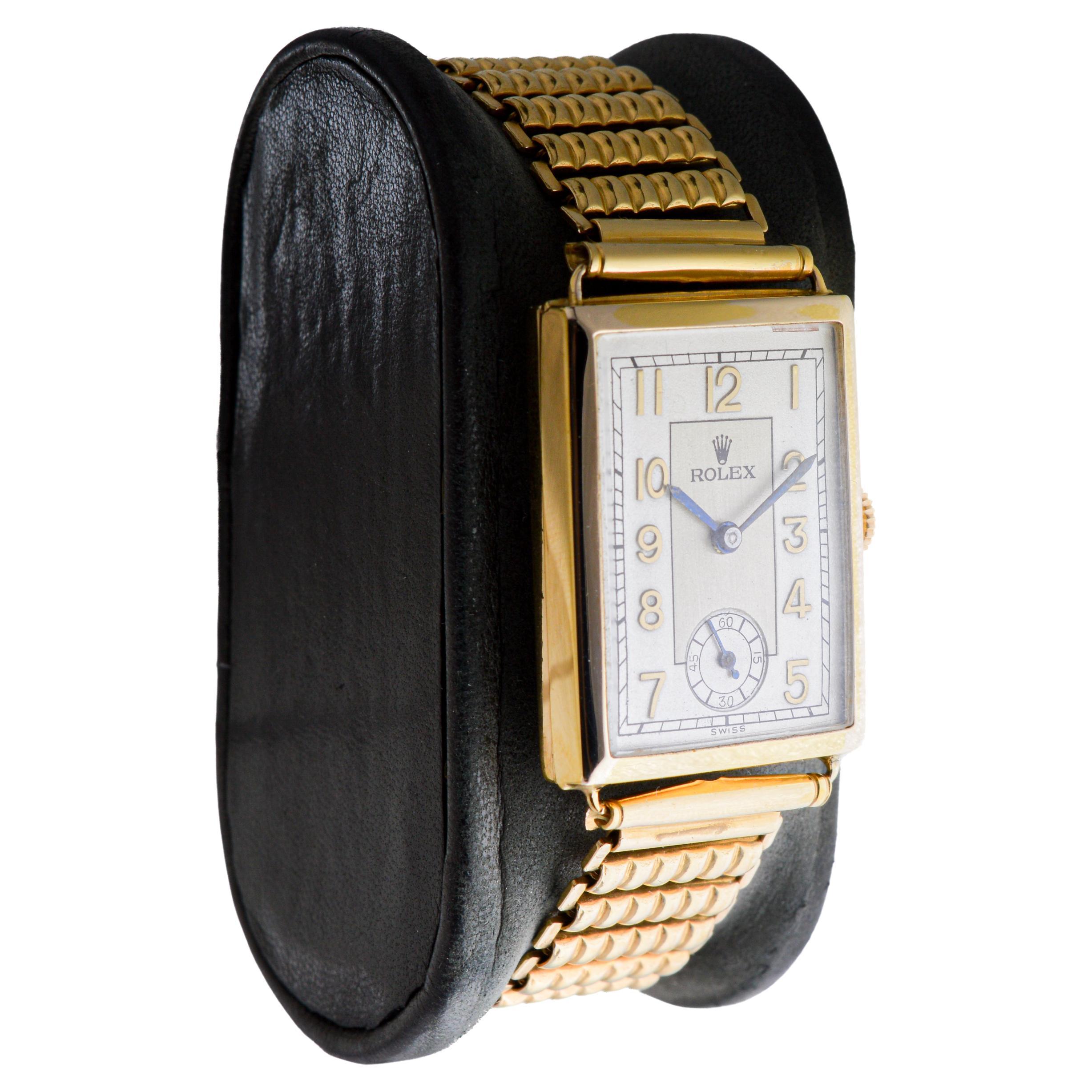 FACTORY / HOUSE: Rolco by Rolex Watch Company
STYLE / REFERENCE: Tank Style / Reference 797
METAL / MATERIAL: 9Ct. Solid Gold
CIRCA / YEAR: 1930's
DIMENSIONS / SIZE: Length 35mm X Width 23mm
MOVEMENT / CALIBER: Manual Winding / 15 Jewels 
DIAL /