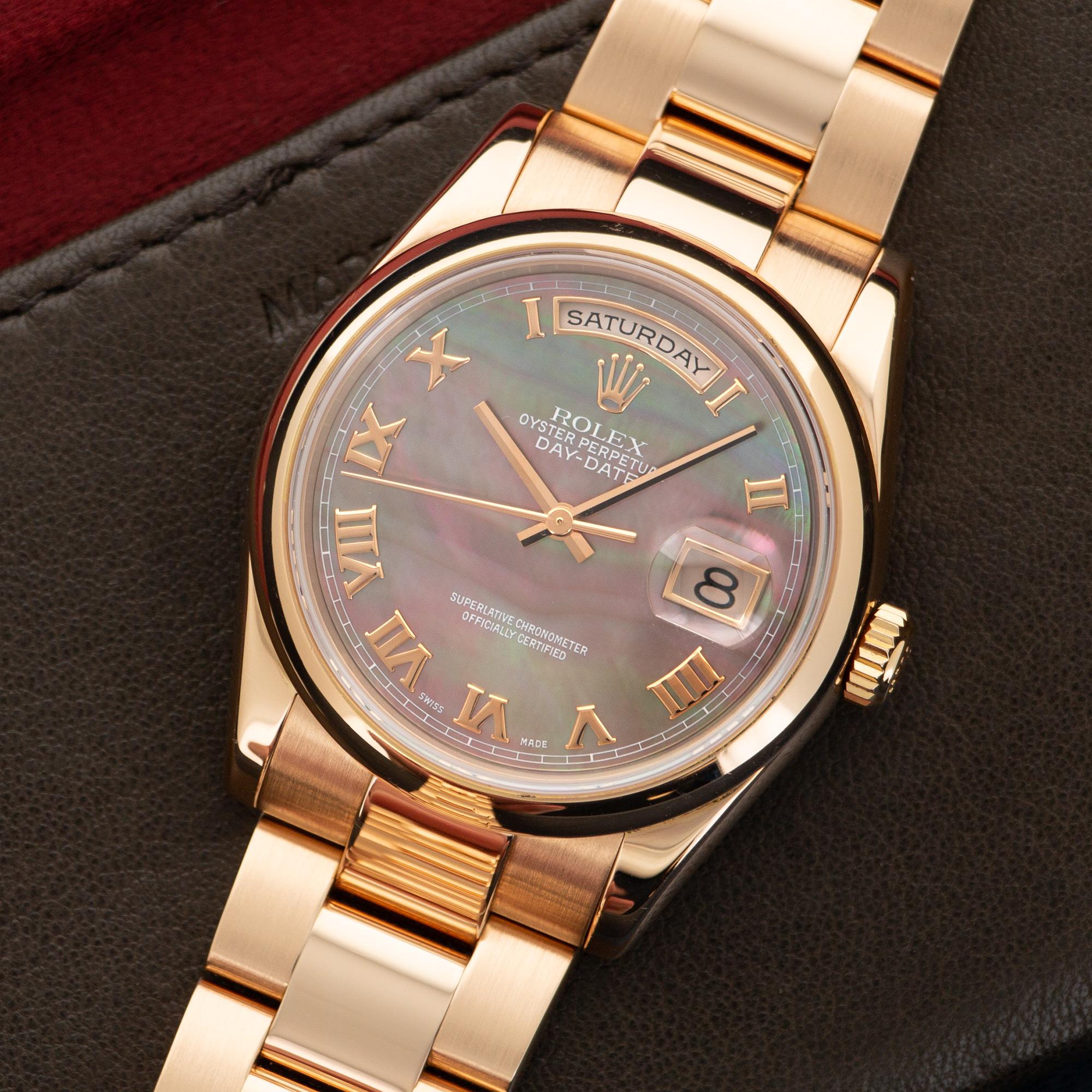 An 18k Rose Gold Day-Date Wristwatch by Rolex. Model 118205. Original Mother of Pearl Dial with Roman Numerals. Circa Early 2000's