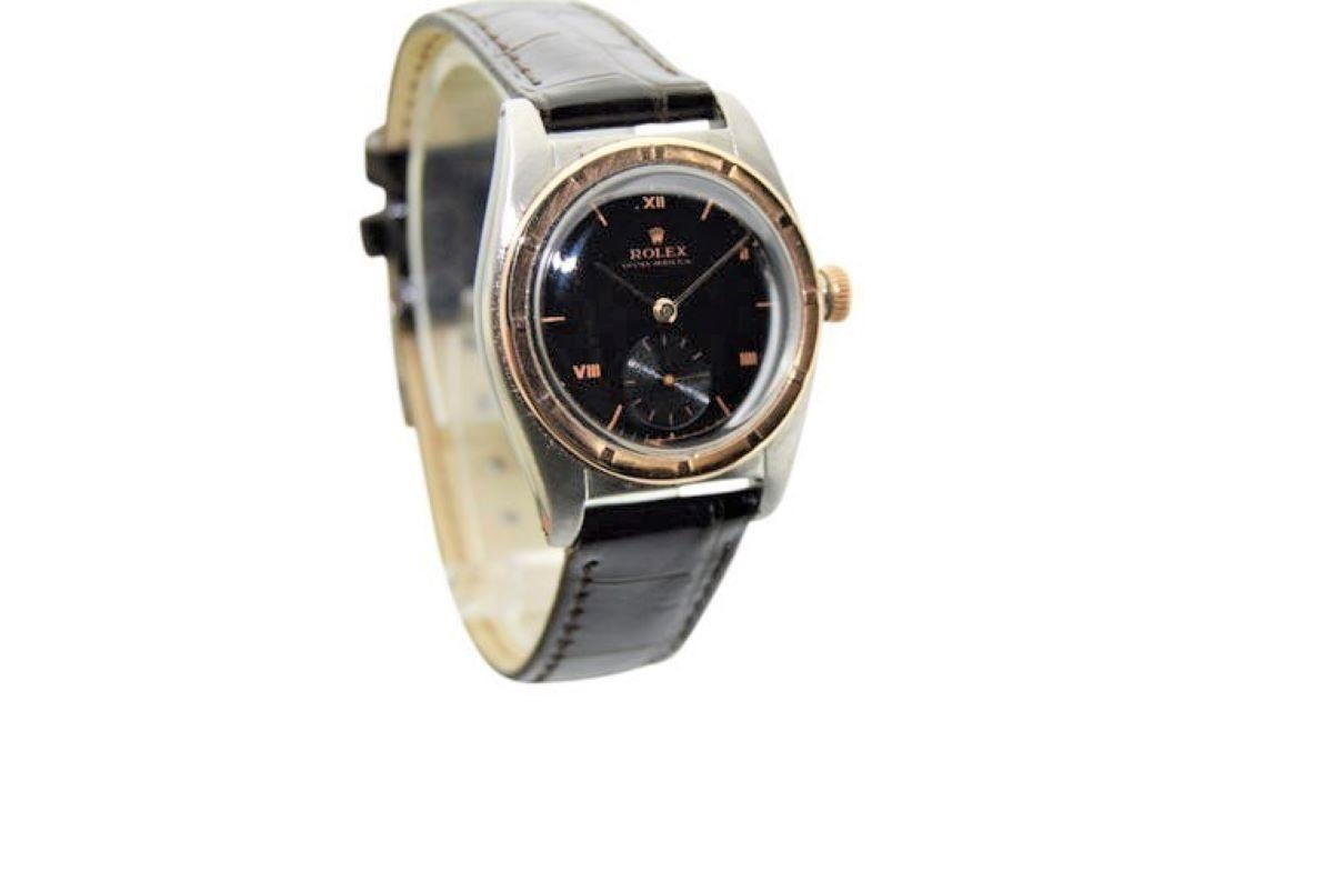  FACTORY / HOUSE: Rolex Watch Company
STYLE / REFERENCE: Bubble Back 
METAL / MATERIAL: Stainless Steel & Solid Rose Gold Thunderbird Bezel
DIMENSIONS: Length 40mm X Diameter 32mm
CIRCA: 1940's
MOVEMENT / CALIBER: Perpetual Winding / 18 Jewels /
