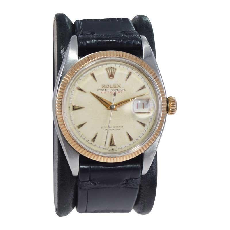 FACTORY / HOUSE: Rolex Watch Company
STYLE / REFERENCE: Datejust / Reference 6305/1
METAL / MATERIAL: Stainless Steel w/ Rose Gold Bezel
DIMENSIONS: Length 42mm  X Diameter 34mm
CIRCA: 1956/57
MOVEMENT / CALIBER: 20 Jewels / Caliber 745
DIAL /