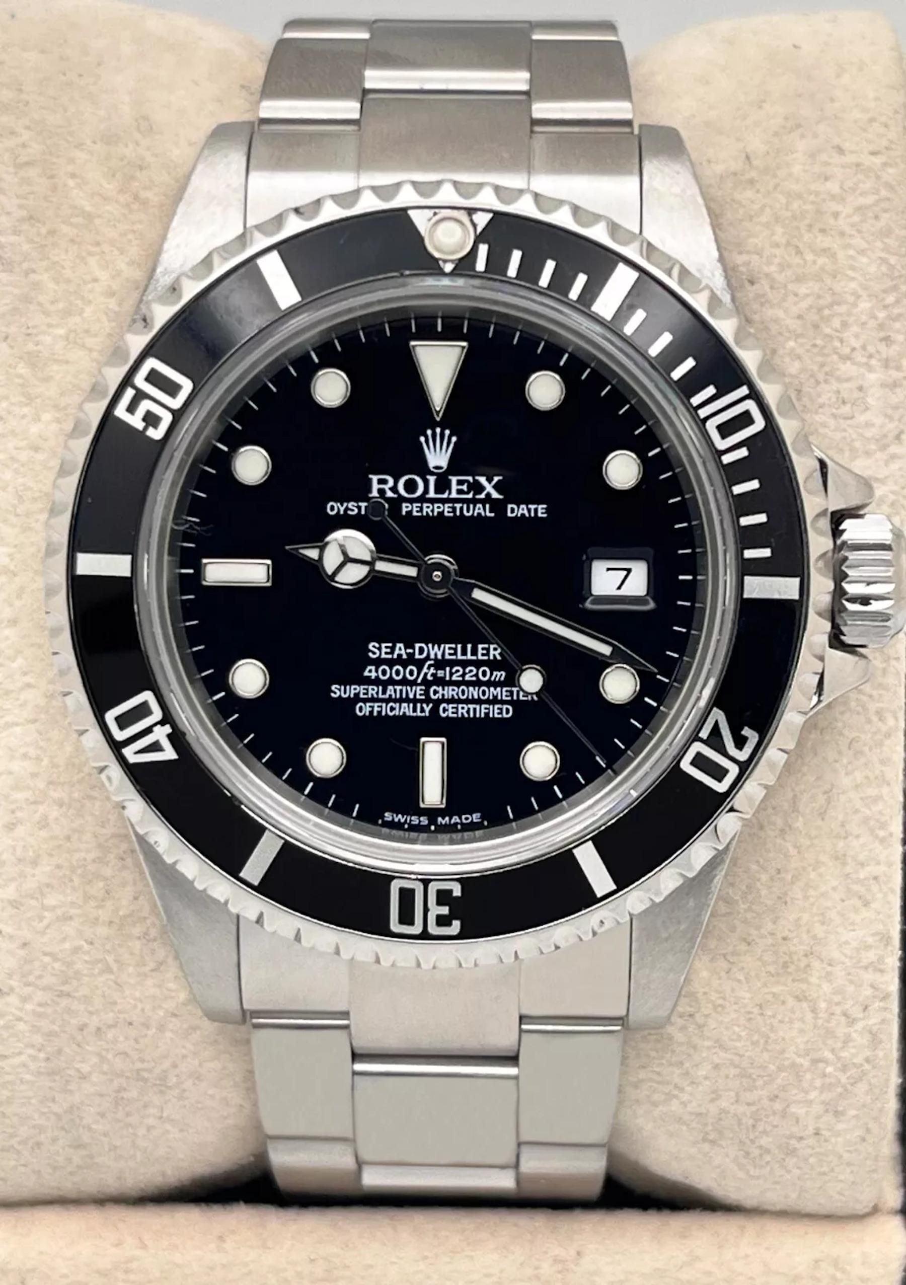 Style Number: 16600
Serial: F714***
Year: 2003
Model: Rolex Sea-Dweller
Case Material: Stainless Steel
Band: Stainless Steel
Bezel: Black
Dial: Black
Face: Sapphire Crystal
Case Size: 40mm
Includes: 
-Elegant Watch Box
-Certified Appraisal 
-1 Year