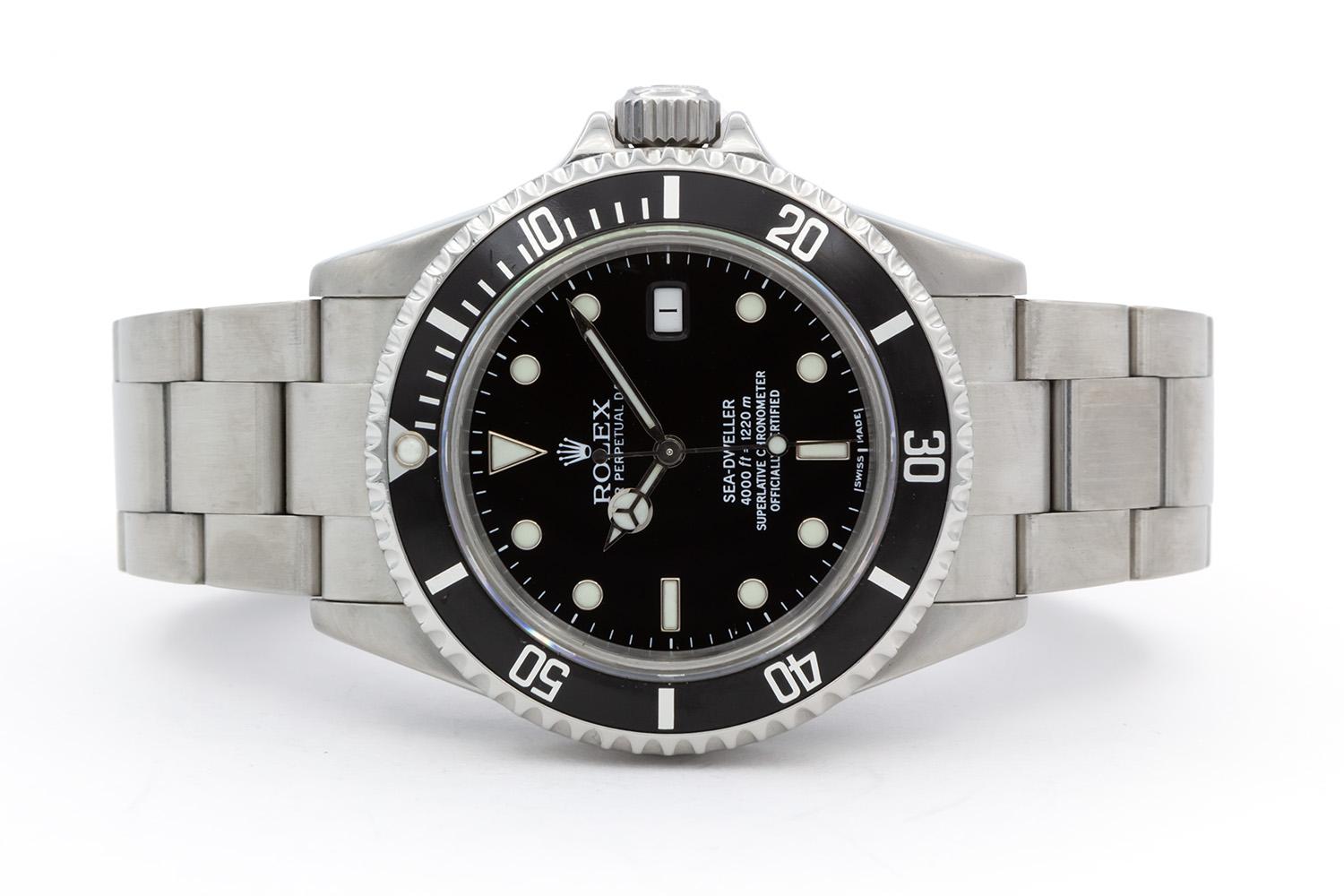 We are pleased to offer this 2003 Rolex Stainless Steel 4000ft Sea-Dweller 16600. This classic and highly sought after Rolex sport watch features a 40mm stainless steel case with helium escape valve and no holes, factory original black time-lapse