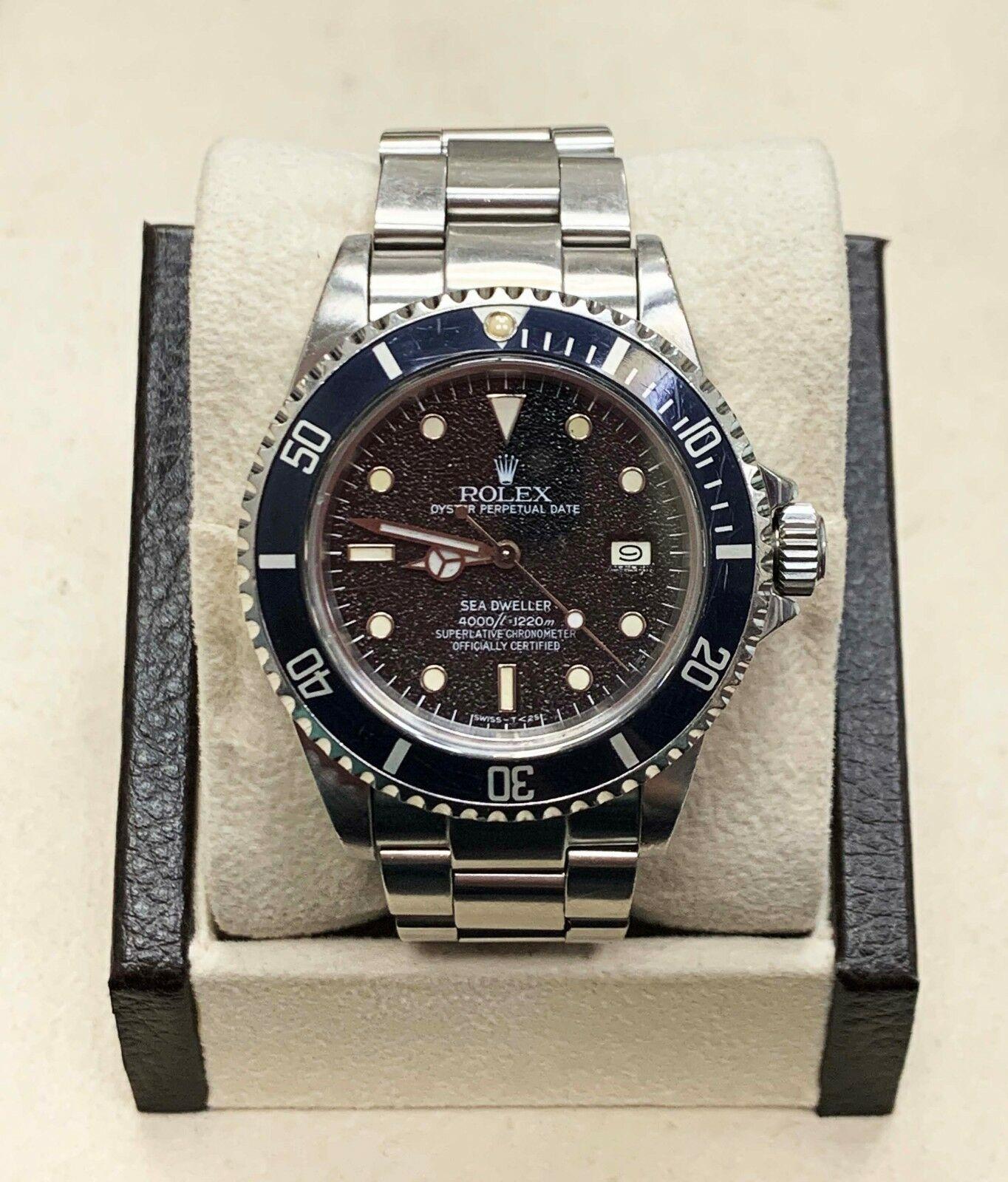 Style Number: 16660
Serial: 8057***
Year: 1984
Model: Sea- Dweller 
Case Material: Stainless Steel 
Band: Stainless Steel 
Bezel: Black
Dial: Black- Very Rare Dial
Face: Sapphire Crystal 
Case Size: 40mm

Includes: 
-Elegant Watch Box
-Certified