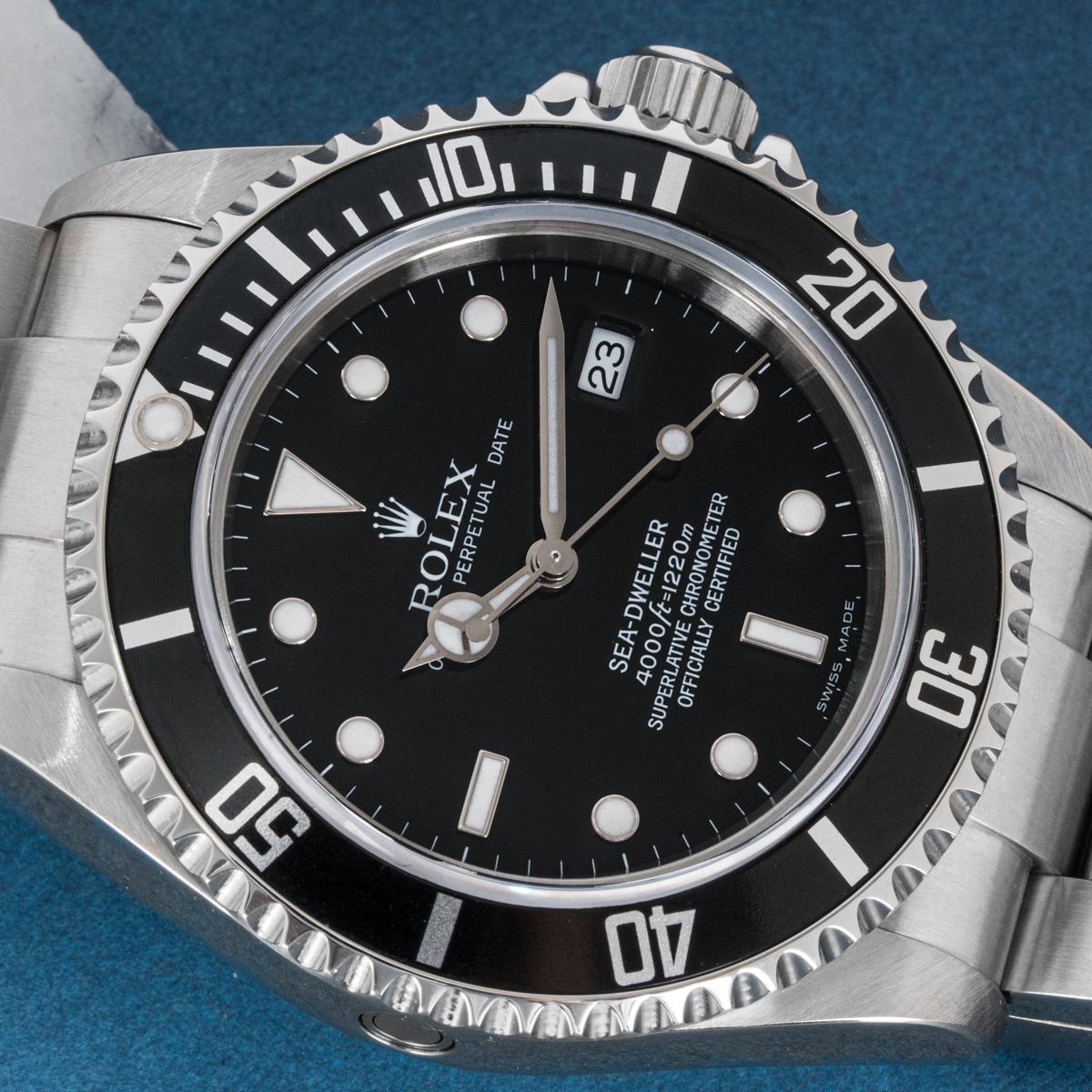 An Oystersteel 40mm Sea-Dweller by Rolex. Featuring a black dial with the date display at 3 o'clock and a black unidirectional rotatable bezel with 60 minute graduations.

The Oyster bracelet is equipped with a folding Oysterlock clasp. Fitted with