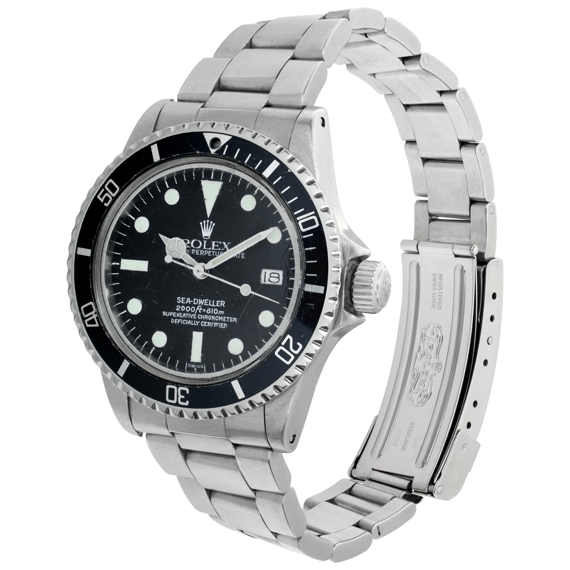 Vintage Rolex Sea-Dweller in stainless steel. With original service papers dated 2008 and Rolex anchor. Auto w/ sweep seconds and date. 40 mm case size. With box and papers. Ref 1665. Circa 1981. **Bank wire only at this price** Fine Pre-owned Rolex