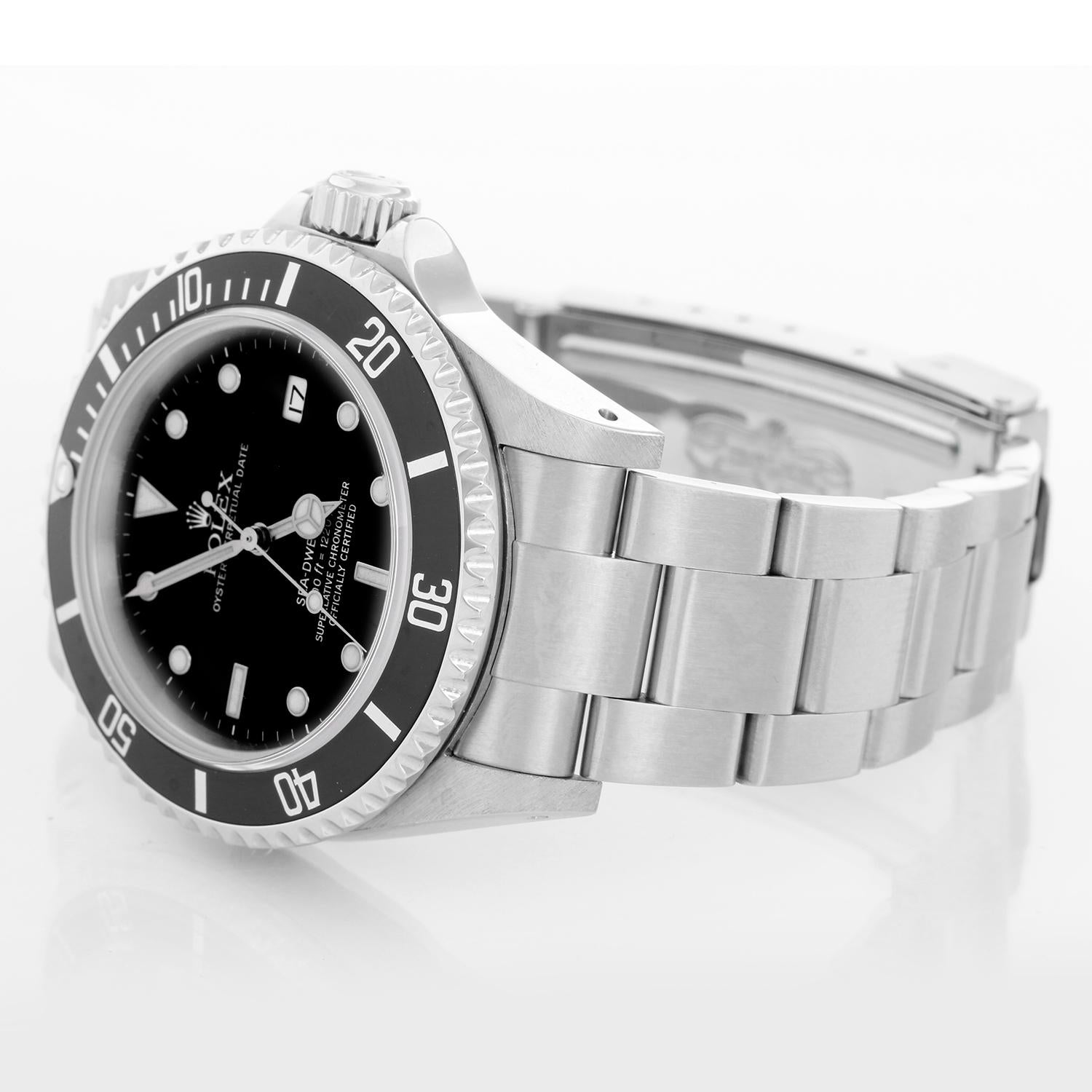 Rolex Sea Dweller Stainless Steel Men's Divers Watch 16600 - Automatic winding, 31 jewels, Quickset, sapphire crystal. Stainless steel case with rotating bezel and helium escape valve (40mm diameter). Black dial with luminous markers. Stainless