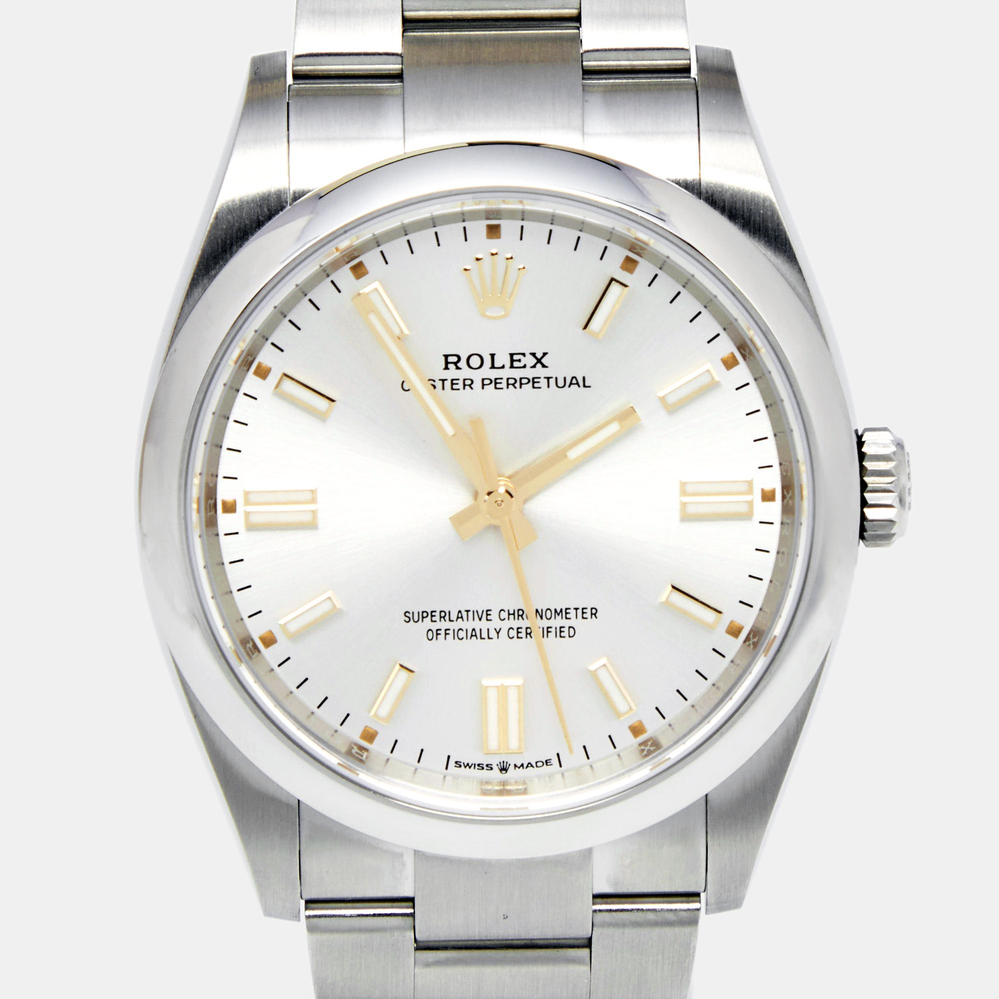Exhibiting a classic appeal, this Oyster Perpetual M126000-0001 Automatic Wristwatch from the house of Rolex is a fine example of elevated style. This watch features a distinctive silver dial with elegant markers and three hands. The stainless steel