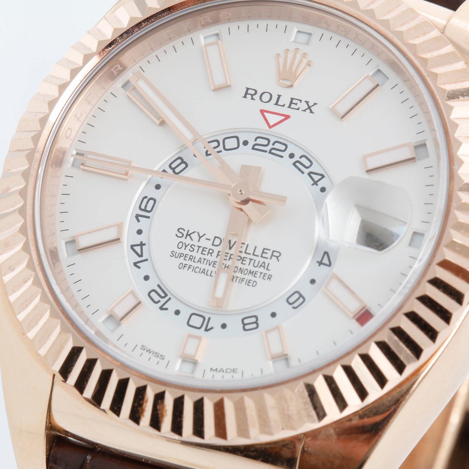 Rolex Sky-Dweller 326135 Men's 18k Rose Gold Annual Calendar GMT Watch  - Automatic winding, perpetual calendar and GMT feature. 18k rose gold case with fluted bezel  (42mm diameter). White dial with rose gold Arabic numerals; date; second time
