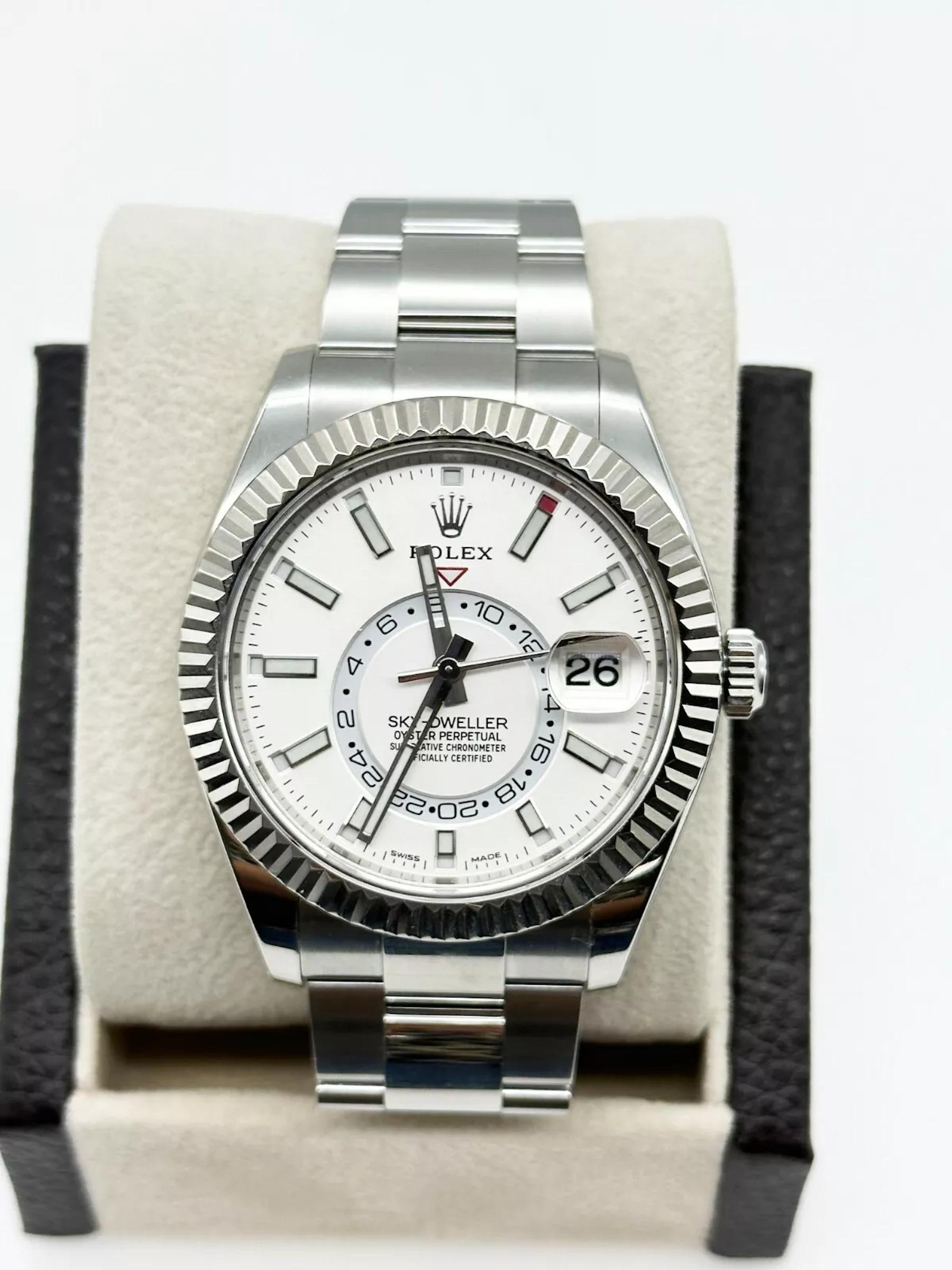 Style Number: 326934

Serial: 93L2***

Year: 2021

Model: Rolex Sky Dweller

Case Material: Stainless Steel 

Band: Stainless Steel 

Bezel: 18K White Gold

Dial: White

Face: Sapphire Crystal  

Case Size: 42mm

 Includes: 

-Rolex Box &