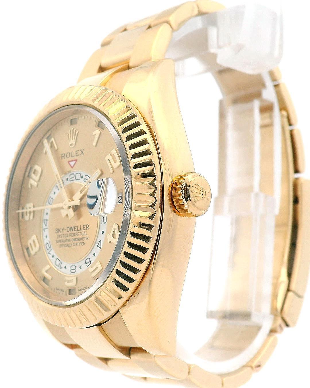 Rolex Sky-Dweller 326938 Mens Watch. 42mm 18K yellow gold case. 18K yellow gold fluted bezel. Champagne dial with luminous gold hands and index hour markers. Minute markers on the outer dial. Date display at the 3 o'clock position. GMT 24 hour
