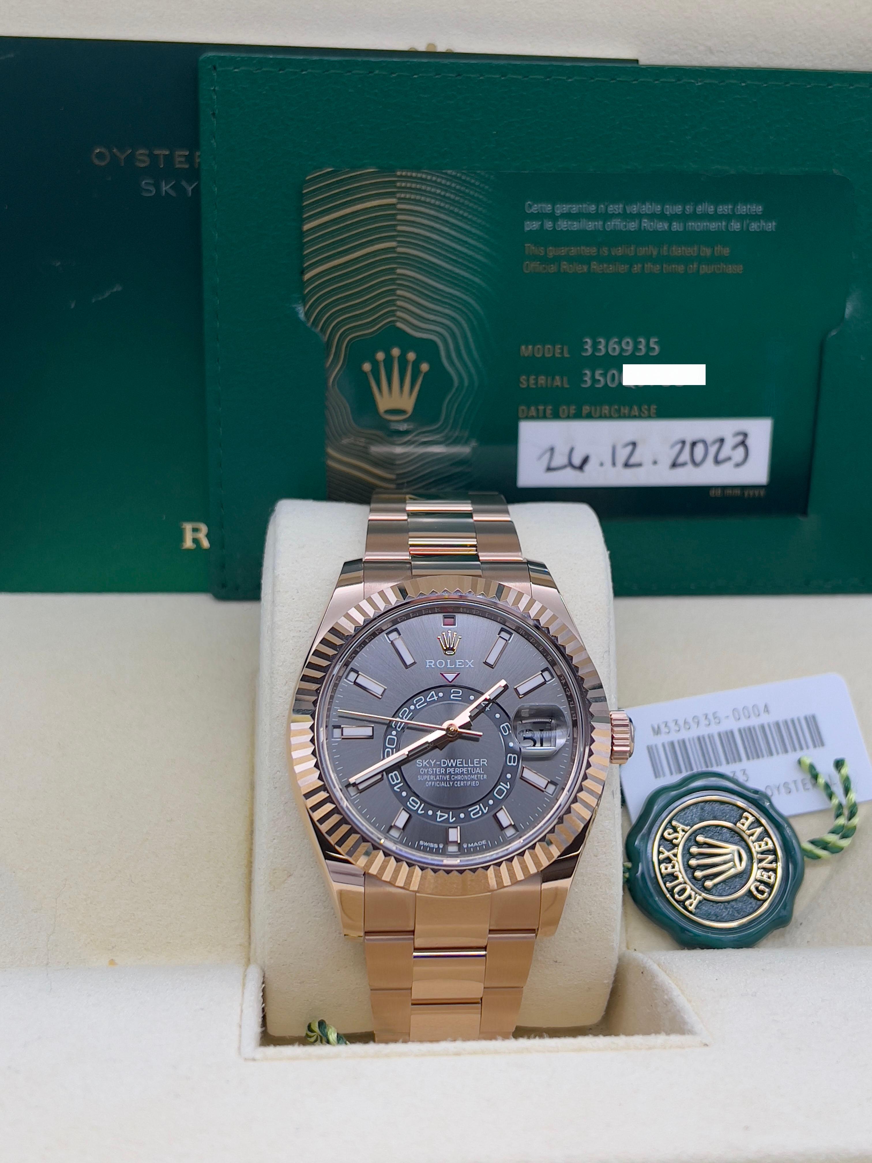 Style Number: 336935
Serial: 350QJ***
Year: 2023
Model: Rolex Sky Dweller
Case Material: 18K Rose Gold 
Band: 18K Rose Gold
Bezel: 18K Rose Gold
Dial: Rhodium Dial 
Face: Sapphire Crystal 
Case Size: 42mm 
Includes: 
-Rolex Box & Paper 
-Certified