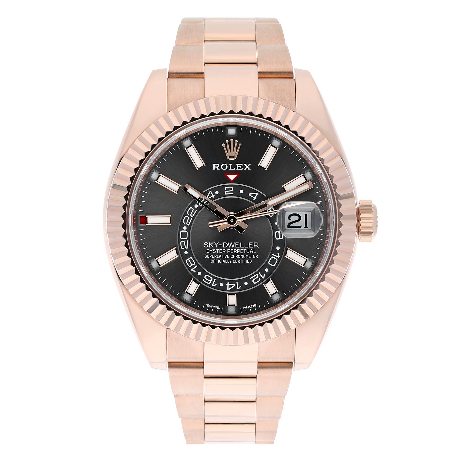 Cette superbe montre Rolex Sky-Dweller de 42 mm est dotée d'un boîtier et d'un bracelet en or rose et d'une lunette cannelée rotative bidirectionnelle. Le cadran en rhodium avec index bâtons et motif soleil ajoute une touche d'élégance à ce luxueux