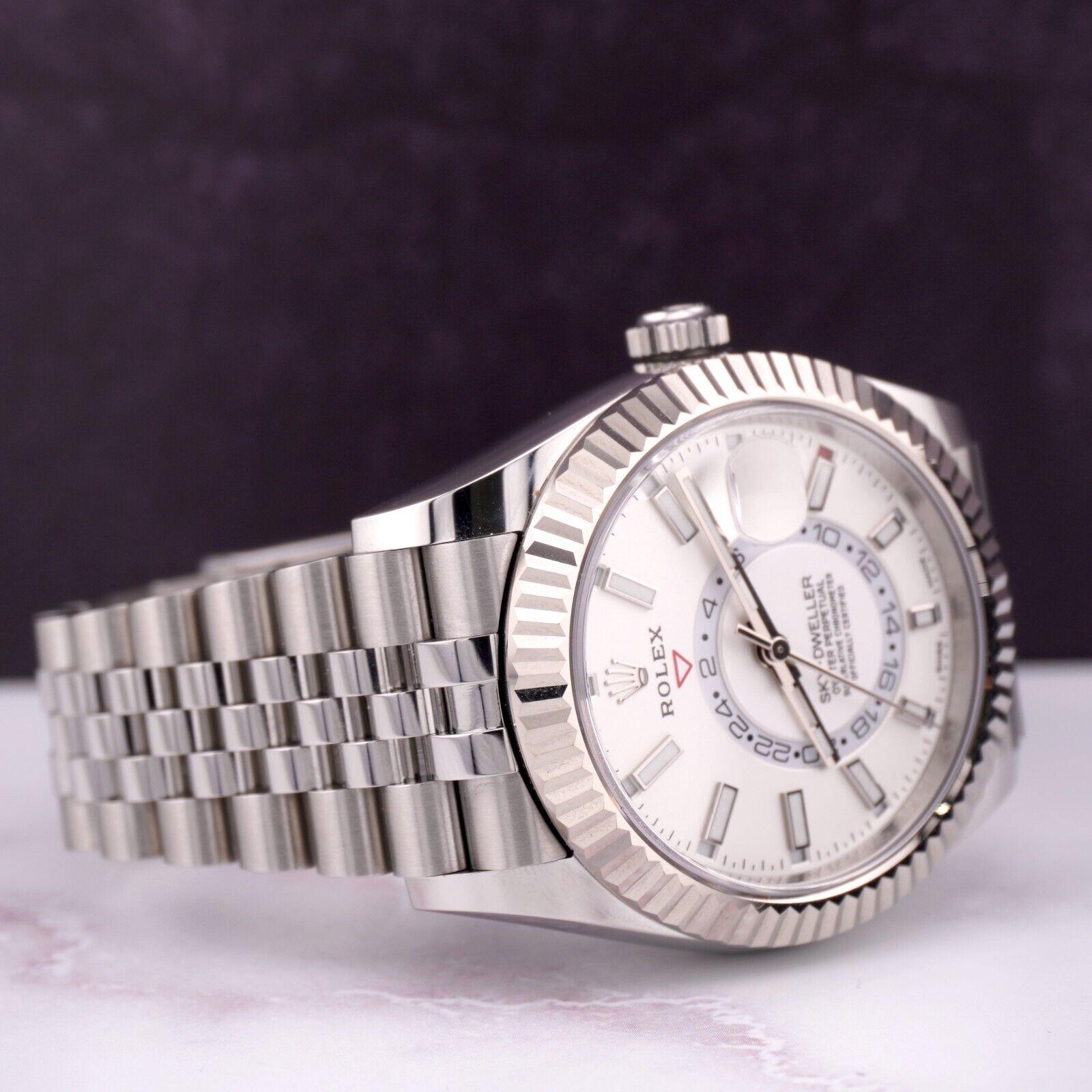 Rolex Sky-Dweller 42mm Watch. A Pre-owned watch w/ Original Box and 2022 Card. Watch is 100% Authentic and Comes with Authenticity Card. Watch Reference is 326934 and is in Excellent Condition (See Pictures). The dial color is White and material is