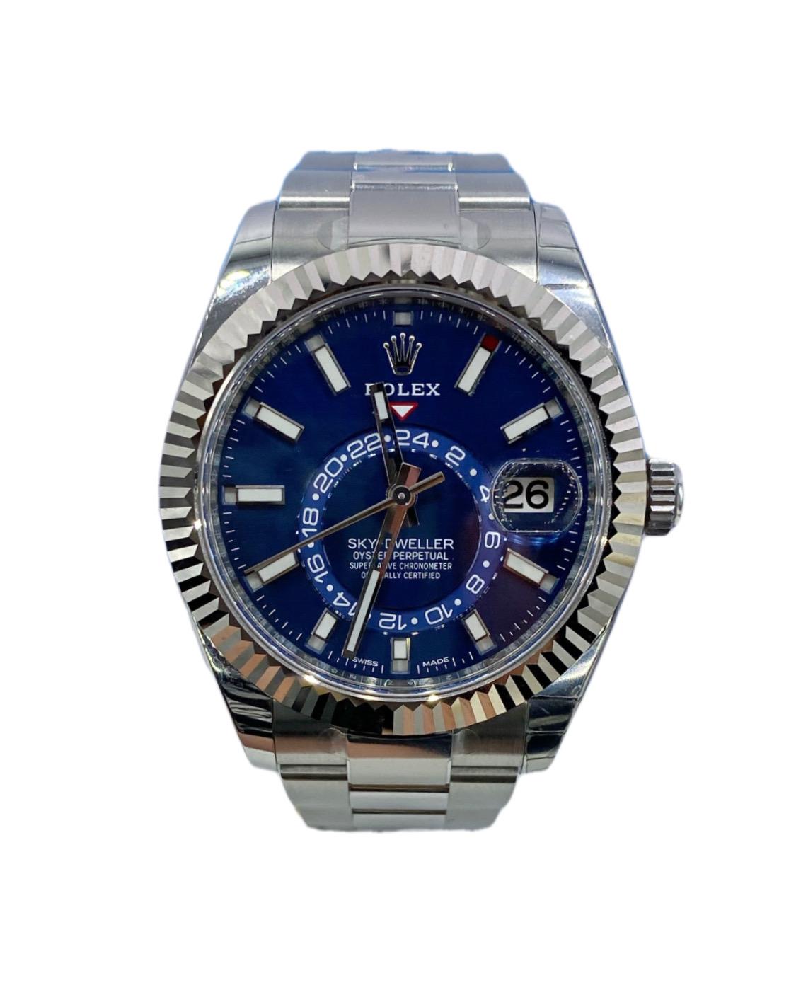 Silver-tone 18kt white gold and stainless steel rolex oyster case with a silver-tone 18kt white gold and stainless steel rolex oyster bracelet. Fluted bezel. Blue dial with silver-tone hands and index hour markers. Dial Type: Analog. Luminescent