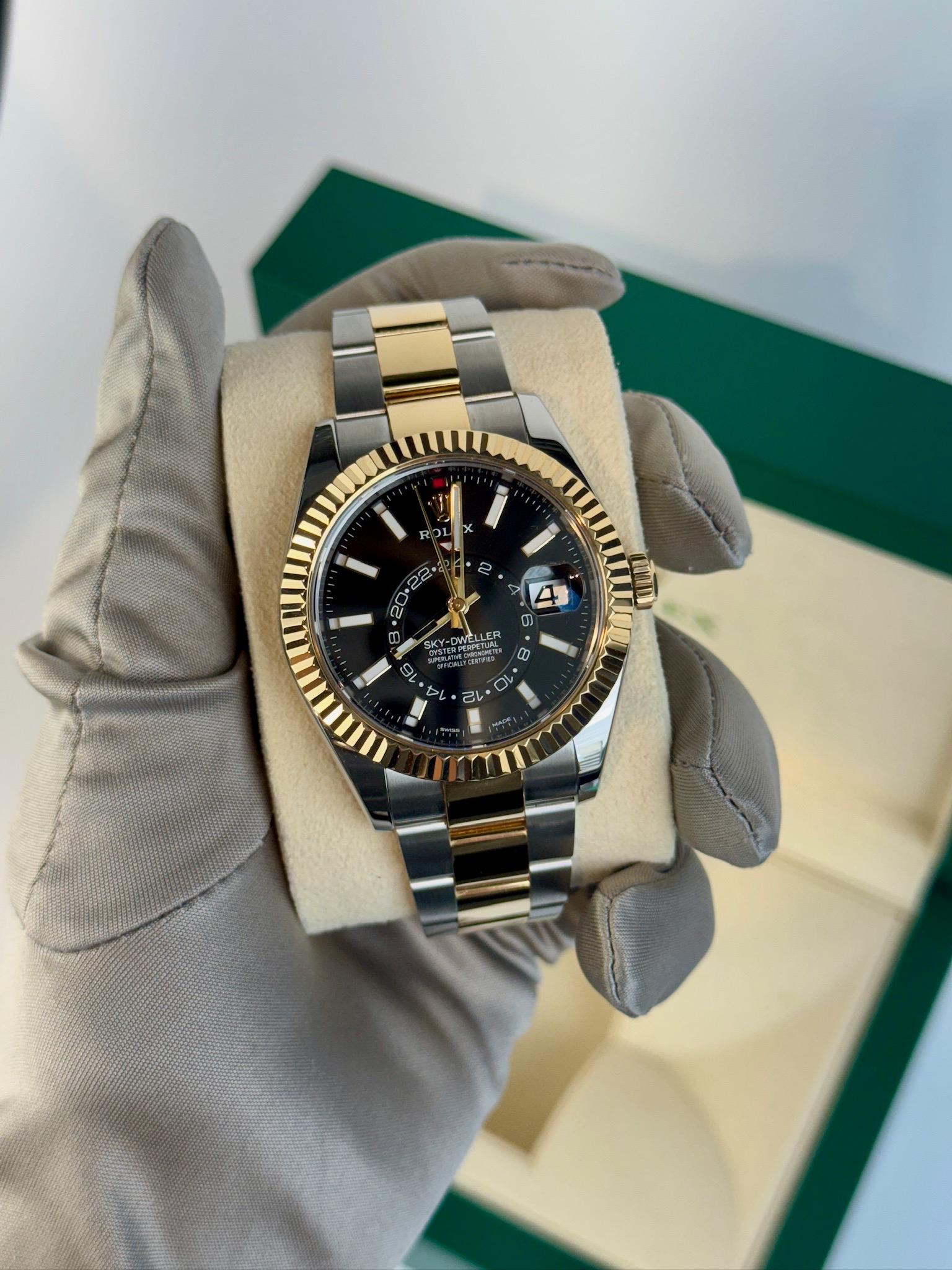 UnwornWatches proudly presents the Rolex Sky-Dweller 326933 is a masterclass in luxury, innovation, and technical brilliance. Its 42mm two-tone case of stainless steel and 18k yellow gold is both striking and versatile. The bold black dial with