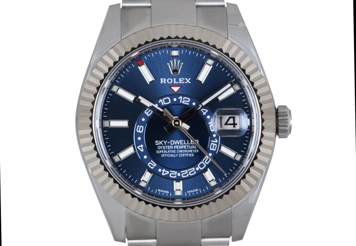 An extremely sought-after stainless steel annual calendar Sky-Dweller by Rolex. Featuring a distinctively bright blue dial with a date, a month display via the 12 apertures, and a 24-hour display as well as a second time zone. Which can be