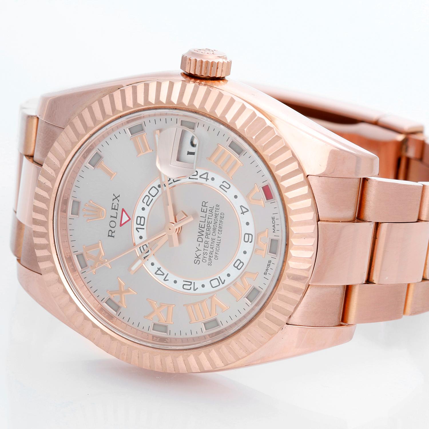 Rolex Sky-Dweller Men's 18k Rose Gold Annual Calendar GMT Watch 326935 - Automatic winding, perpetual calendar and GMT feature. 18k rose gold case with fluted bezel  (42mm diameter). Sundust dial with rose gold Roman numerals; date; second time