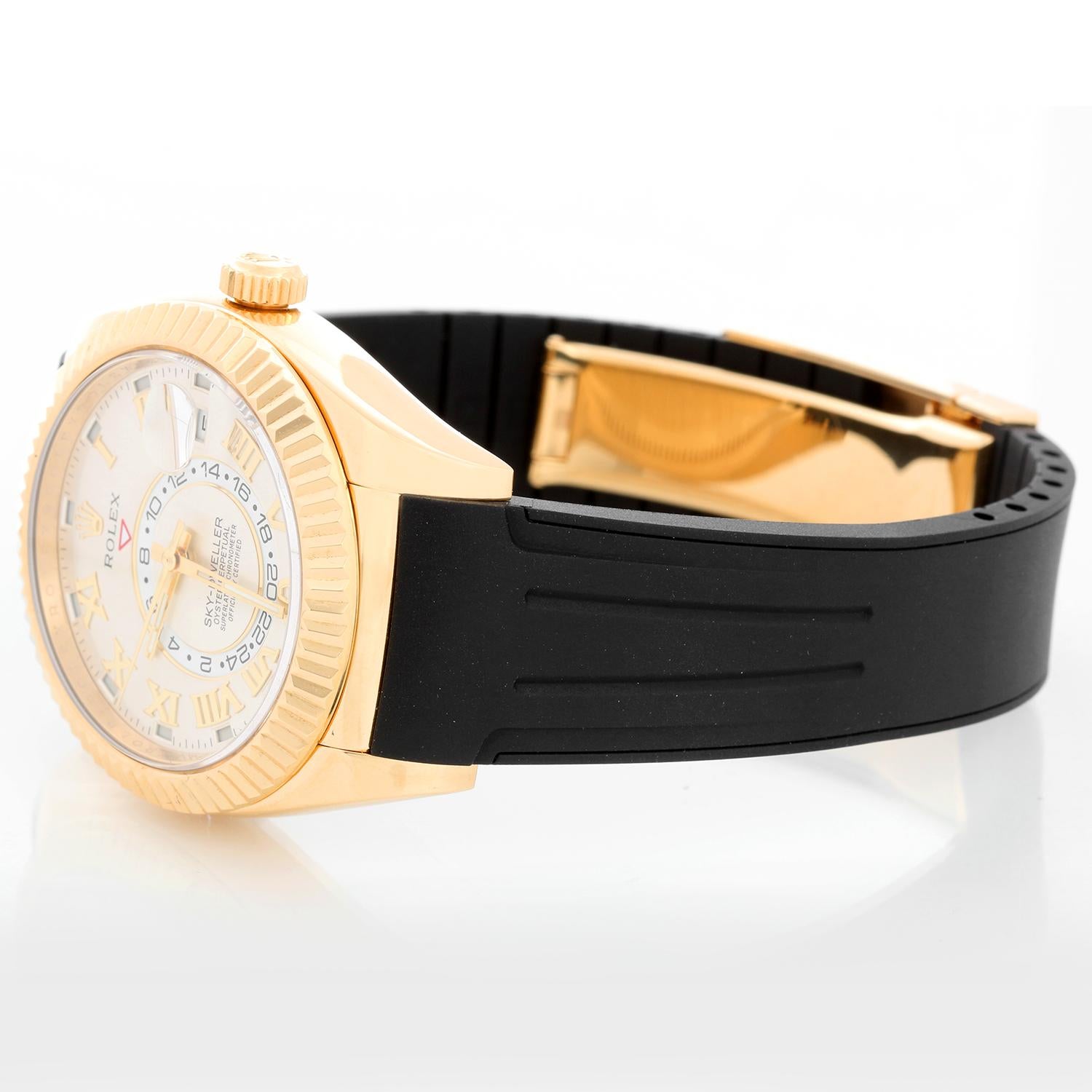 Rolex Sky-Dweller Men's 18k Yellow Gold Annual Calendar GMT Watch 326138 - Automatic winding, perpetual calendar and GMT feature. 18k yellow gold case with fluted bezel  (42mm diameter). Silver dial with Roman Numerals hour markers. Black  rubber