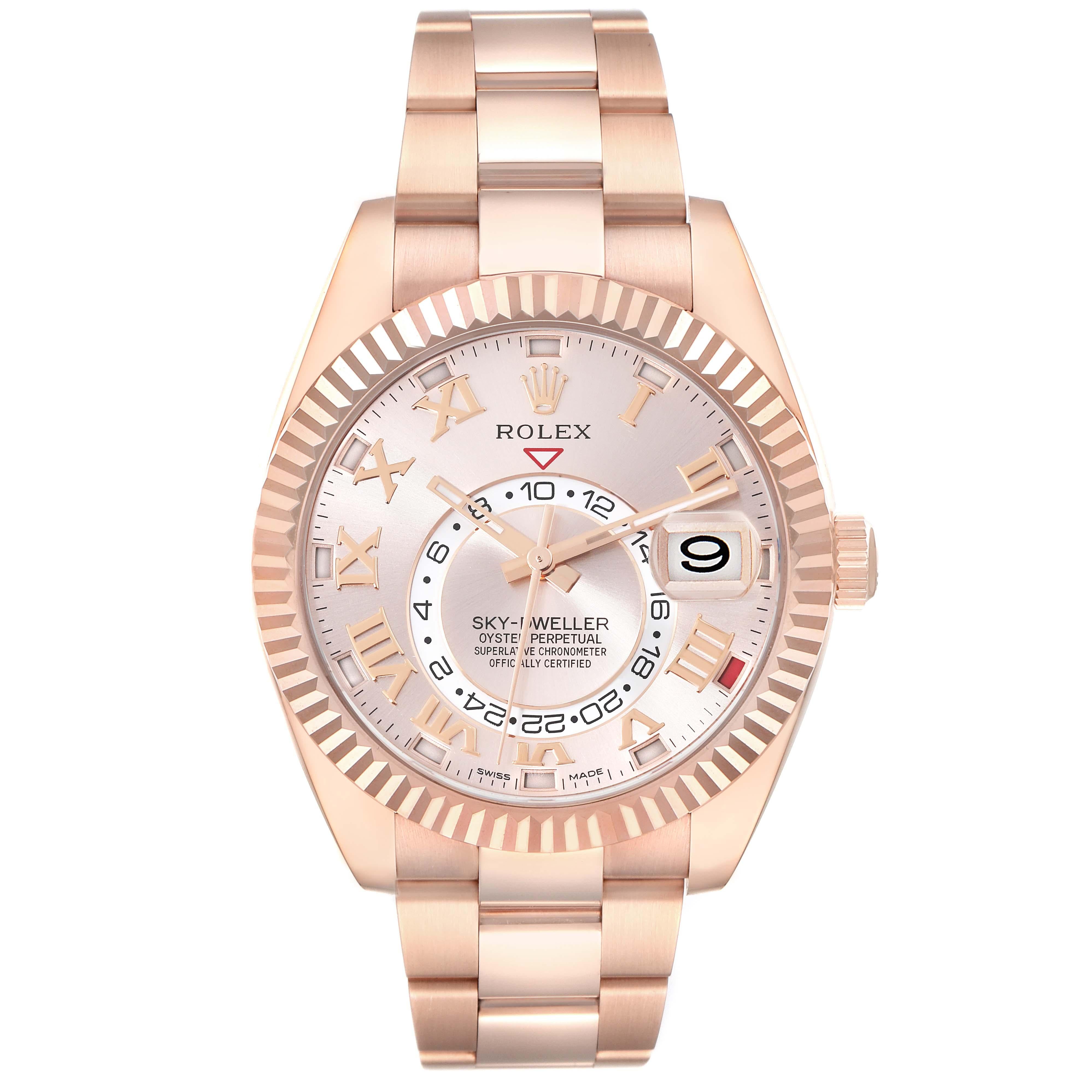 Rolex Sky-Dweller Rose Gold Sundust Dial Mens Watch 326935 Box Card. Officially certified chronometer self-winding movement. Dual time zones, annual calendar. Paramagnetic blue Parachrom hairspring. High-performance Paraflex shock absorbers. 18k