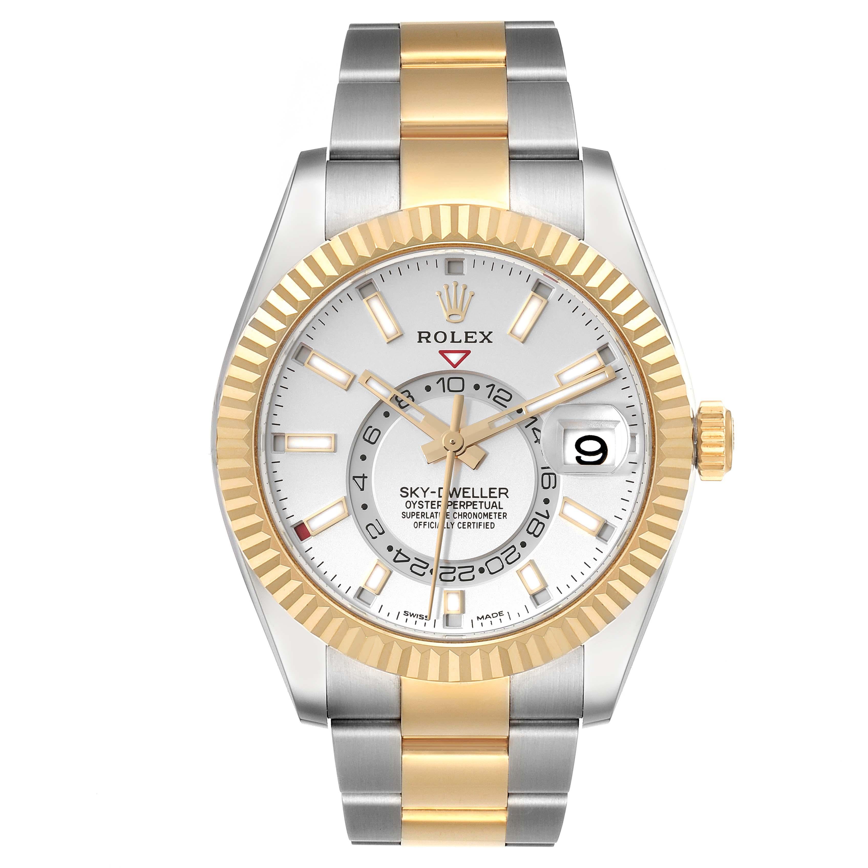 Rolex Sky Dweller Yellow Gold Steel White Dial Mens Watch 326933 Box Card. Officially certified chronometer automatic self-winding movement. Dual time zones, annual calendar. Paramagnetic blue Parachrom hairspring. High-performance Paraflex shock