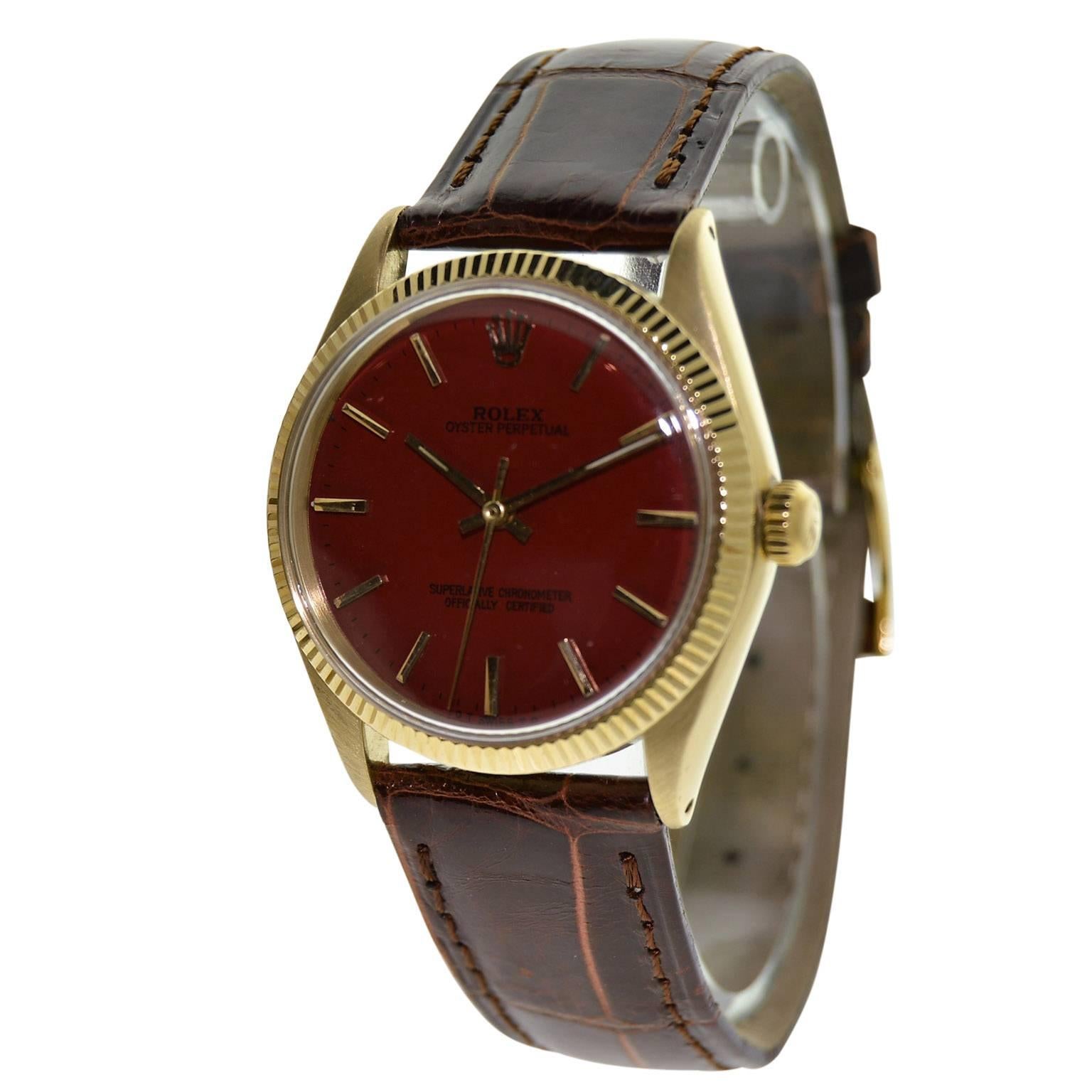 Women's or Men's Rolex Yellow Gold Custom Red Dial Oyster Perpetual Wristwatch, circa 1960s