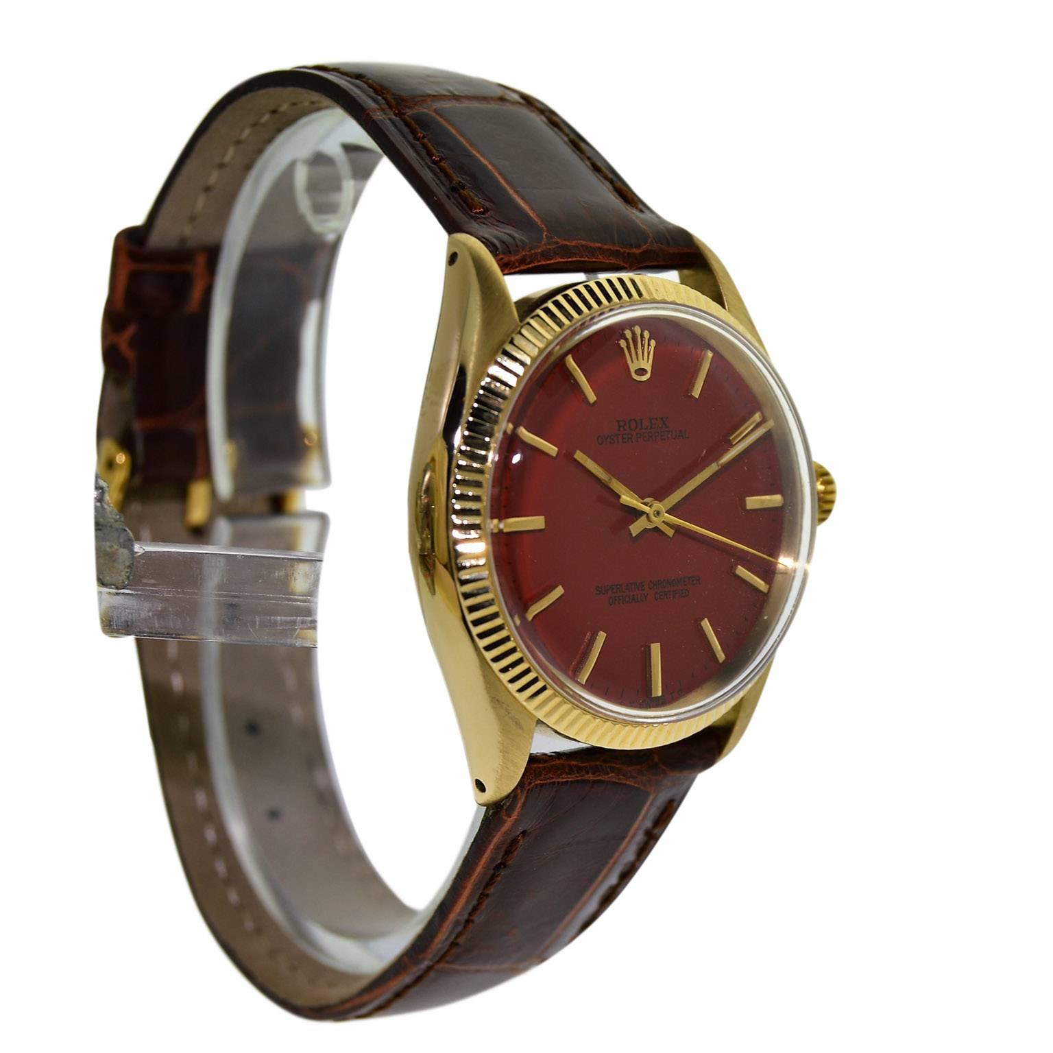 Rolex Yellow Gold Custom Red Dial Oyster Perpetual Wristwatch, circa 1960s 1