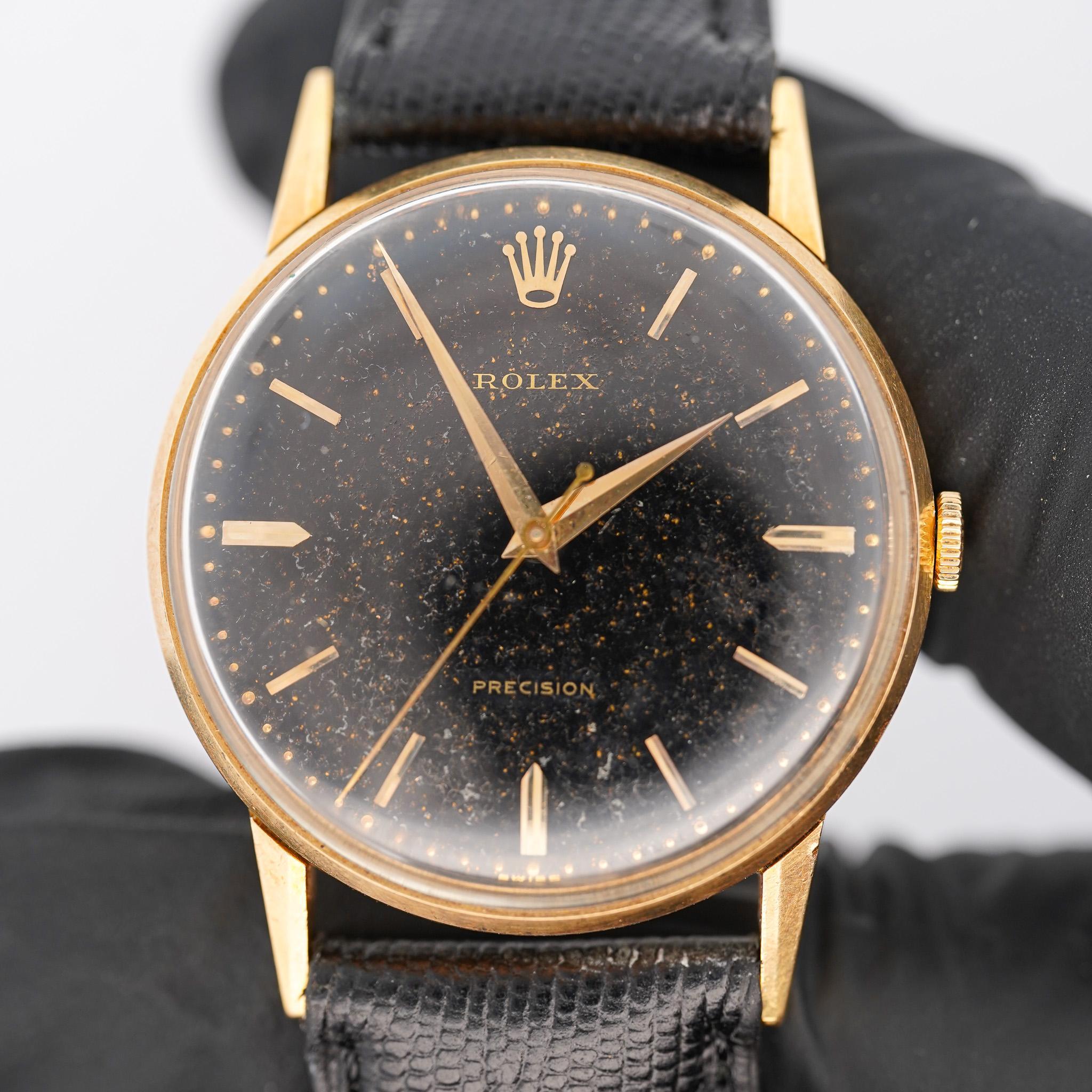 An extremely unique Rolex speckled gold and black dial 33mm Precision model watch in 18k gold.

Vintage Rolex Precision manual-wind watch in 18K yellow gold featuring a 33mm round case with distinctive speckled black dial, applied gold baton hour