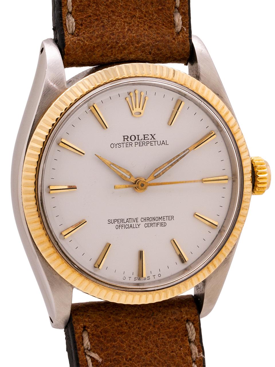 
Rolex Stainless Steel and 14K yellow gold Oyster Perpetual ref 1005 serial #1.6 million circa 1963. Featuring 34mm diameter case with fine engine turned “milled” bezel and acrylic crystal. With professionally refinished white dial, with applied