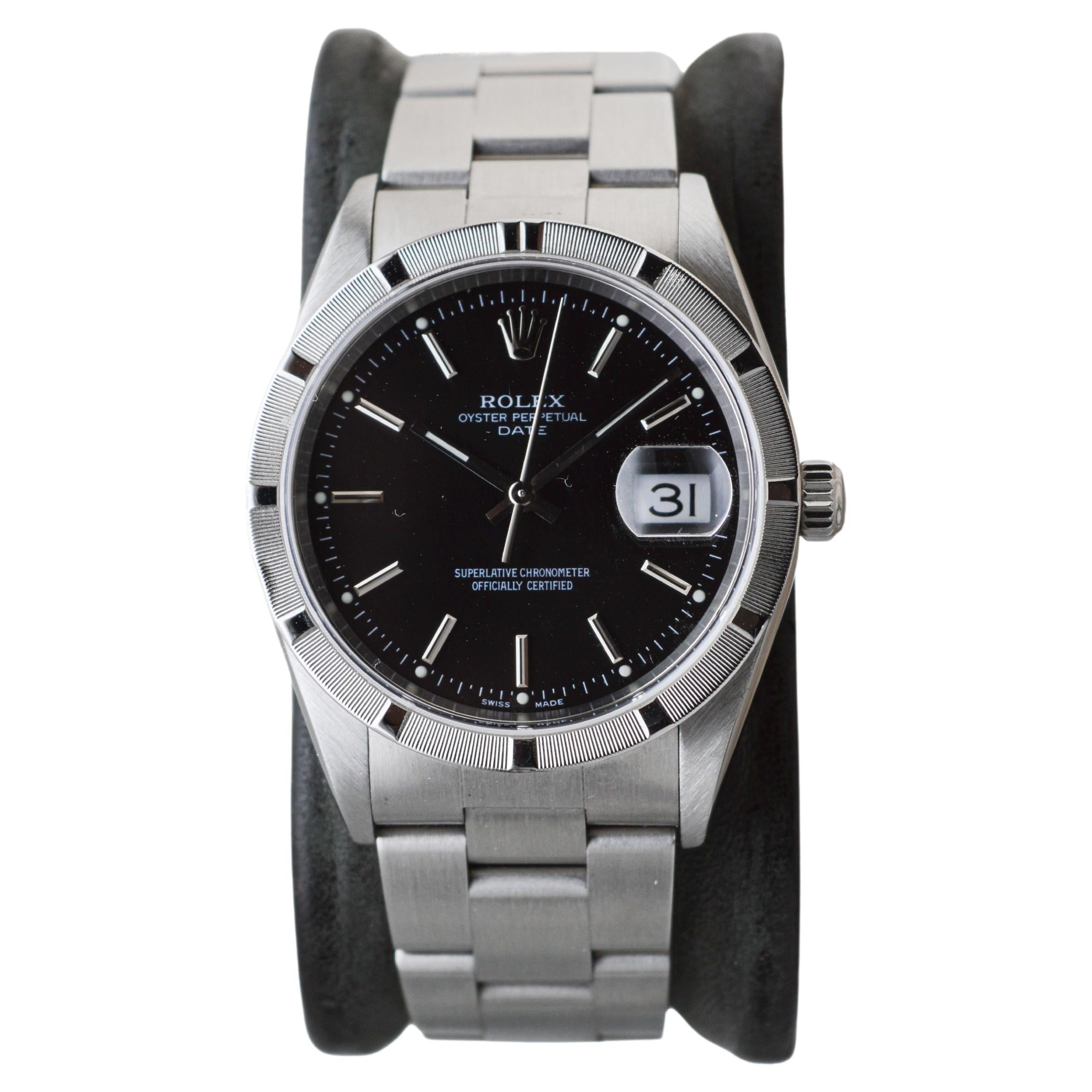 Modern Rolex Stainless Oyster Perpetual Date With Rare Factory Original Black Dial 2002 For Sale