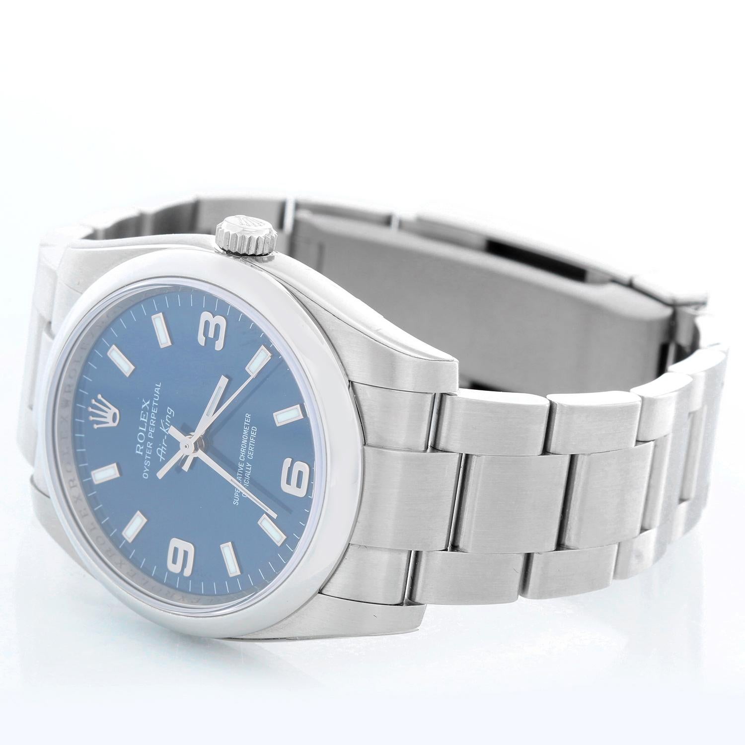 Automatic movement, 31 jewels, sapphire crystal. Stainless steel case with stainless steel smooth bezel (34mm diameter). Blue dial with Arabic numerals and luminous baton indexes. Stainless steel Oyster bracelet. Pre-owned with custom box 