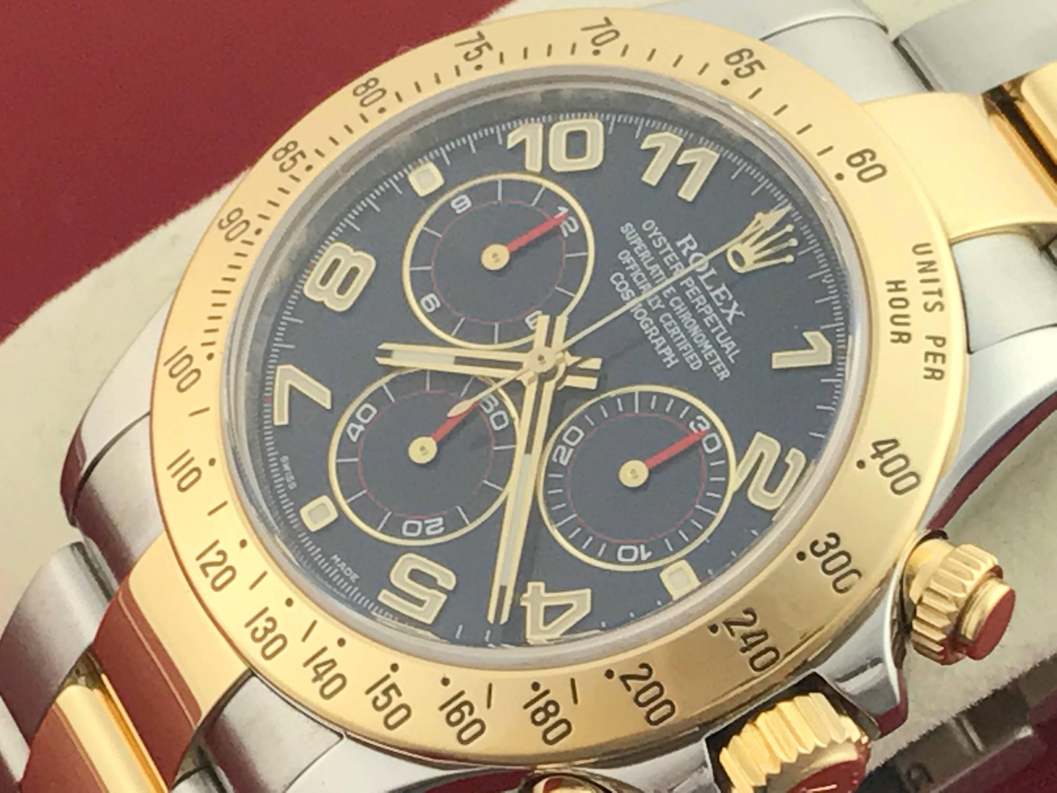 Rolex Men's Daytona Model 116523 at a great price.  Automatic Winding Oyster Perpetual Cosmograph, Blue dial with luminous Arabic numerals.  Stainless steel case with 18k yellow gold bezel, Stainless Steel and 18k Yellow Gold Oyster bracelet with