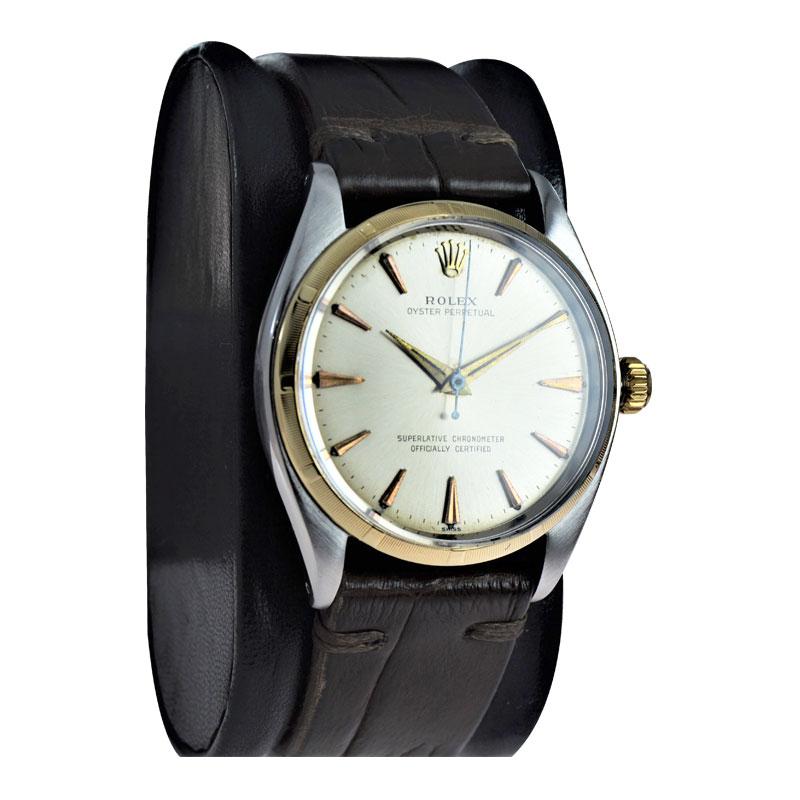 FACTORY / HOUSE: Rolex Watch Co.
STYLE / REFERENCE: Oyster Perpetual / Reference 1003
METAL / MATERIAL: Stainless Steel case / Yellow Gold Bezel
CIRCA / YEAR: 1961
DIMENSIONS / SIZE: Length 40mm x Diameter 34mm
MOVEMENT / CALIBER: Perpetual Winding