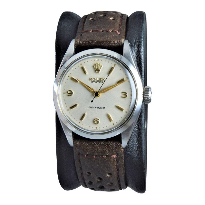 FACTORY / HOUSE: Rolex Watch Company
STYLE / REFERENCE: Oyster / Art Deco
METAL / MATERIAL: Stainless Steel
DIMENSIONS: 38mm X 32mm
CIRCA: 1955 / 1956
MOVEMENT / CALIBER: Manual Winding / 17 Jewels 
DIAL / HANDS: Original Silvered Gilt Baton Markers