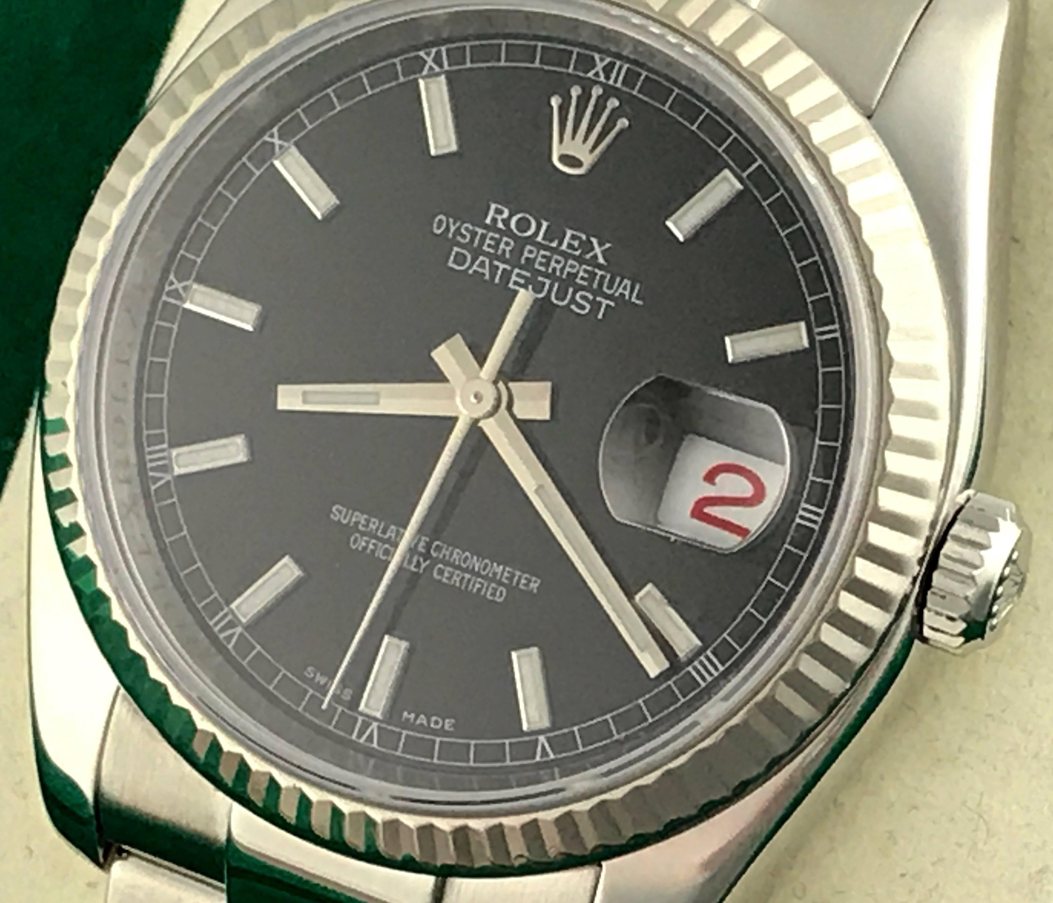 Mens Rolex Datejust Model 116234 Stainless Steel Automatic Wrist Watch. Certified pre-owned and ready to ship.  Stainless Steel case with 18k white gold fluted bezel, 36mm diameter.  Stainless Steel oyster bracelet. Black dial with luminous hour