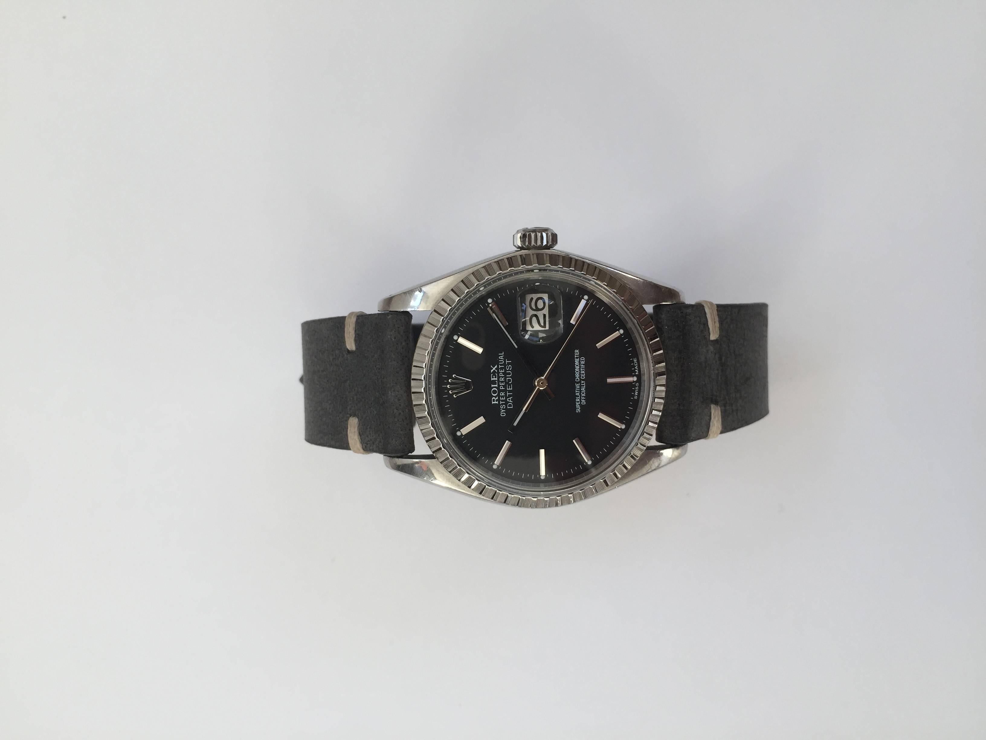 Rolex Stainless Steel Oyster Perpetual Datejust Watch
Rare Factory Black Matte Swiss Made Dial with Applied Hour Markers which glow with matching hands
Stainless Steel Engine-T turned Bezel
Stainless Steel Case
36mm in size 
Features Rolex Automatic