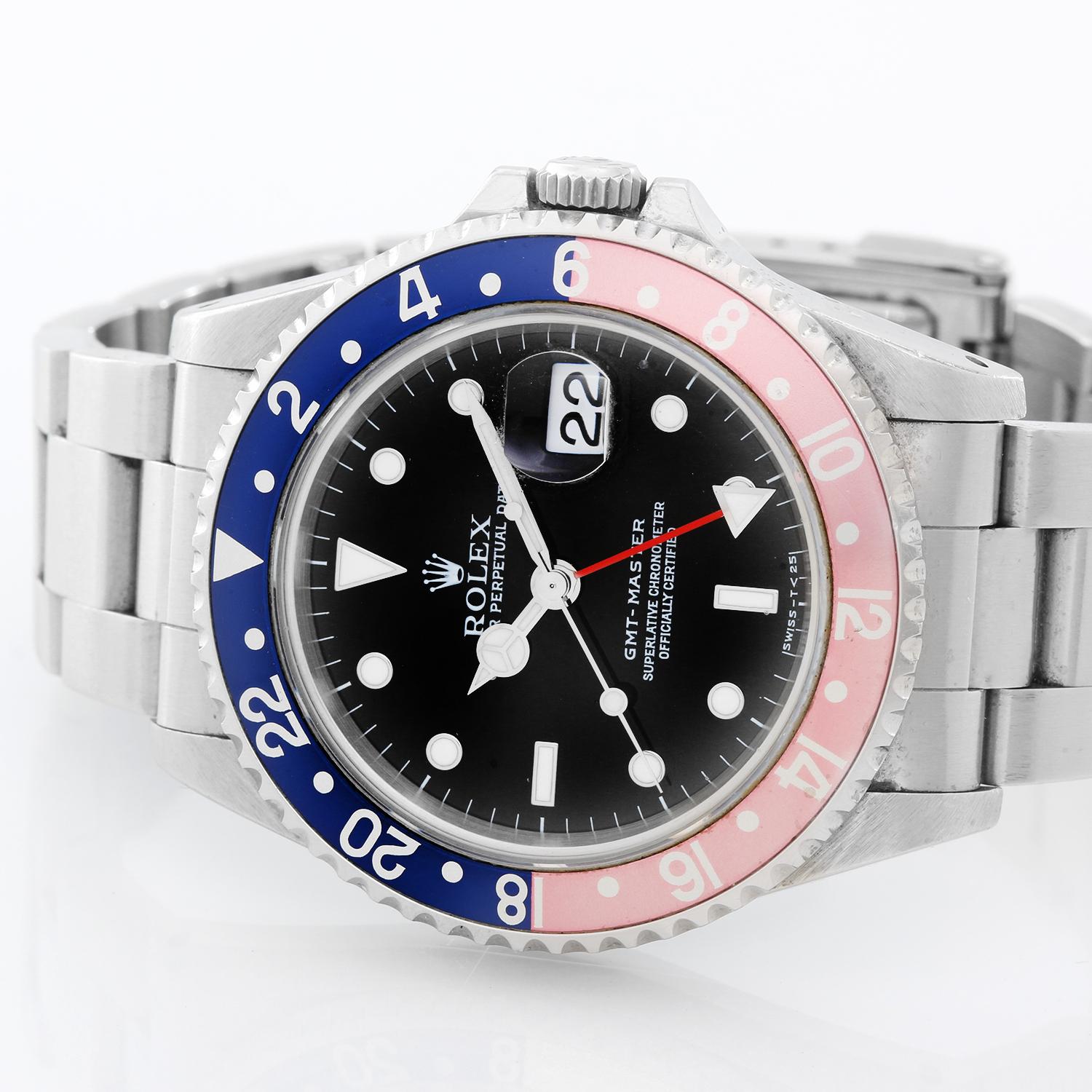 Rolex GMT-Master Men's Stainless Steel Watch Blue Bezel 16700 - Automatic winding, 31 jewels, Quickset, sapphire crystal. Stainless steel case  with rotating black (40mm diameter). Beautiful even faded insert. Vintage patina black dial with