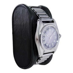 Rolex Montre chronomètre Bubbleback en acier inoxydable avec cadran noir, années 1940