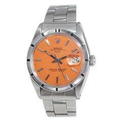 Date Rolex en acier inoxydable avec cadran orange:: circa 1970's