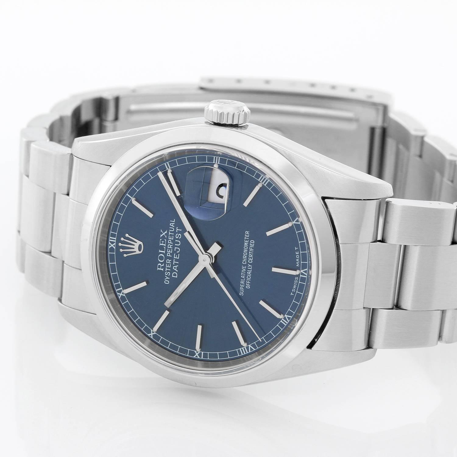 Rolex Datejust Stainless Steel Men's Watch 16200 -  Automatic winding, Quickset, sapphire crystal. Stainless steel case with smooth bezel (36mm diameter). Blue dial with with white gold stick markers. Stainless steel Oyster bracelet. Pre-owned with