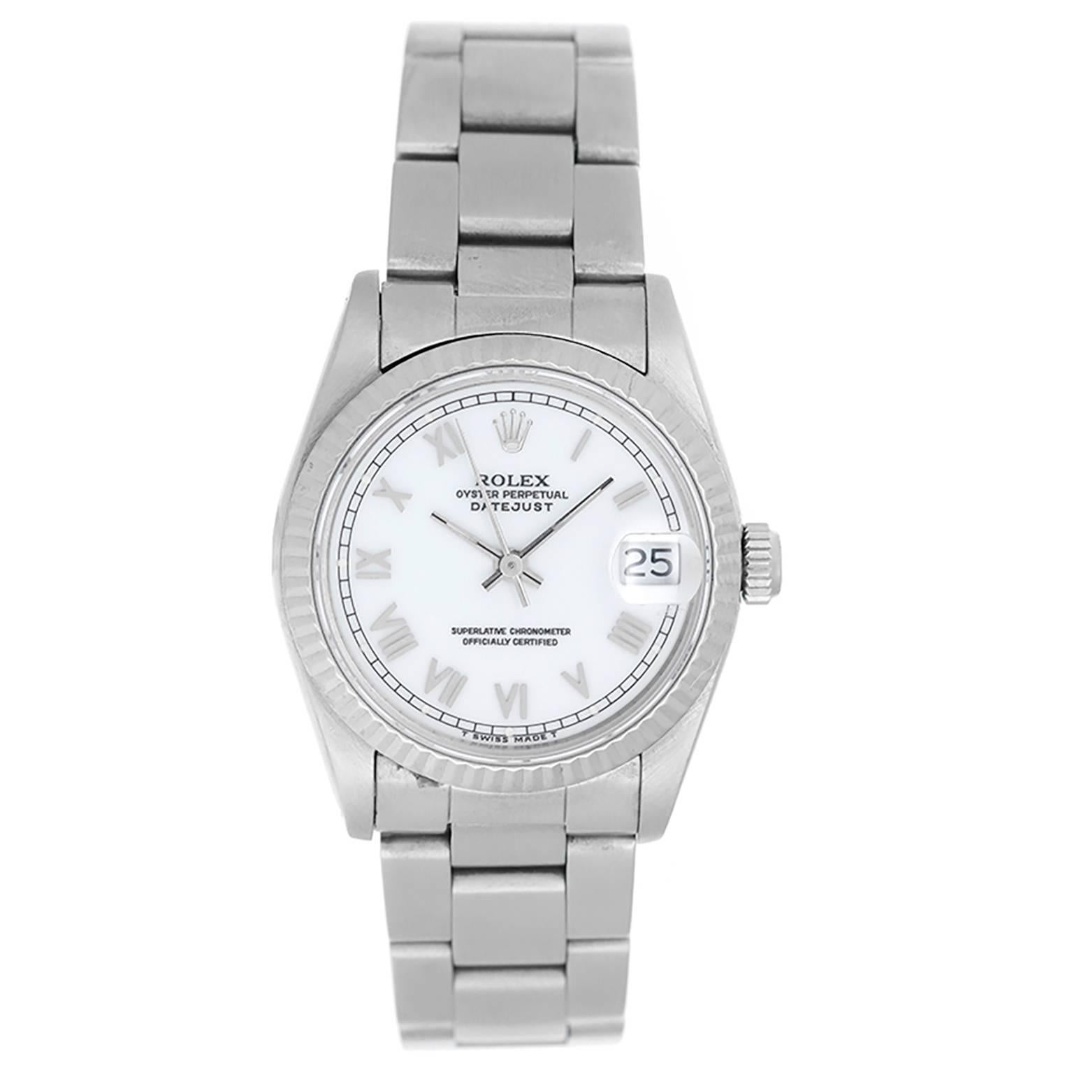 Rolex Datejust Midsize Men's or Ladies Steel Watch 68274 - Automatic winding, 29 jewels, Quickset date, sapphire crystal. Stainless steel case with 18k white gold fluted bezel (31mm diameter). White dial with Roman numerals . Stainless steel Oyster