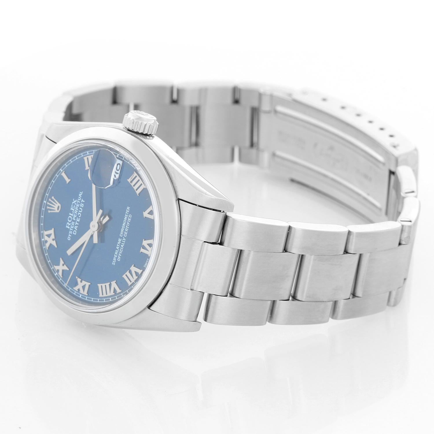 Rolex Stainless Steel Datejust Midsize Watch 78240 - Automatic winding. Stainless steel case (31mm) with smooth bezel. Blue dial with Roman numerals. Stainless steel Oyster bracelet; fits up to a 6 3/4 inch wrist . Pre-owned with Rolex box and