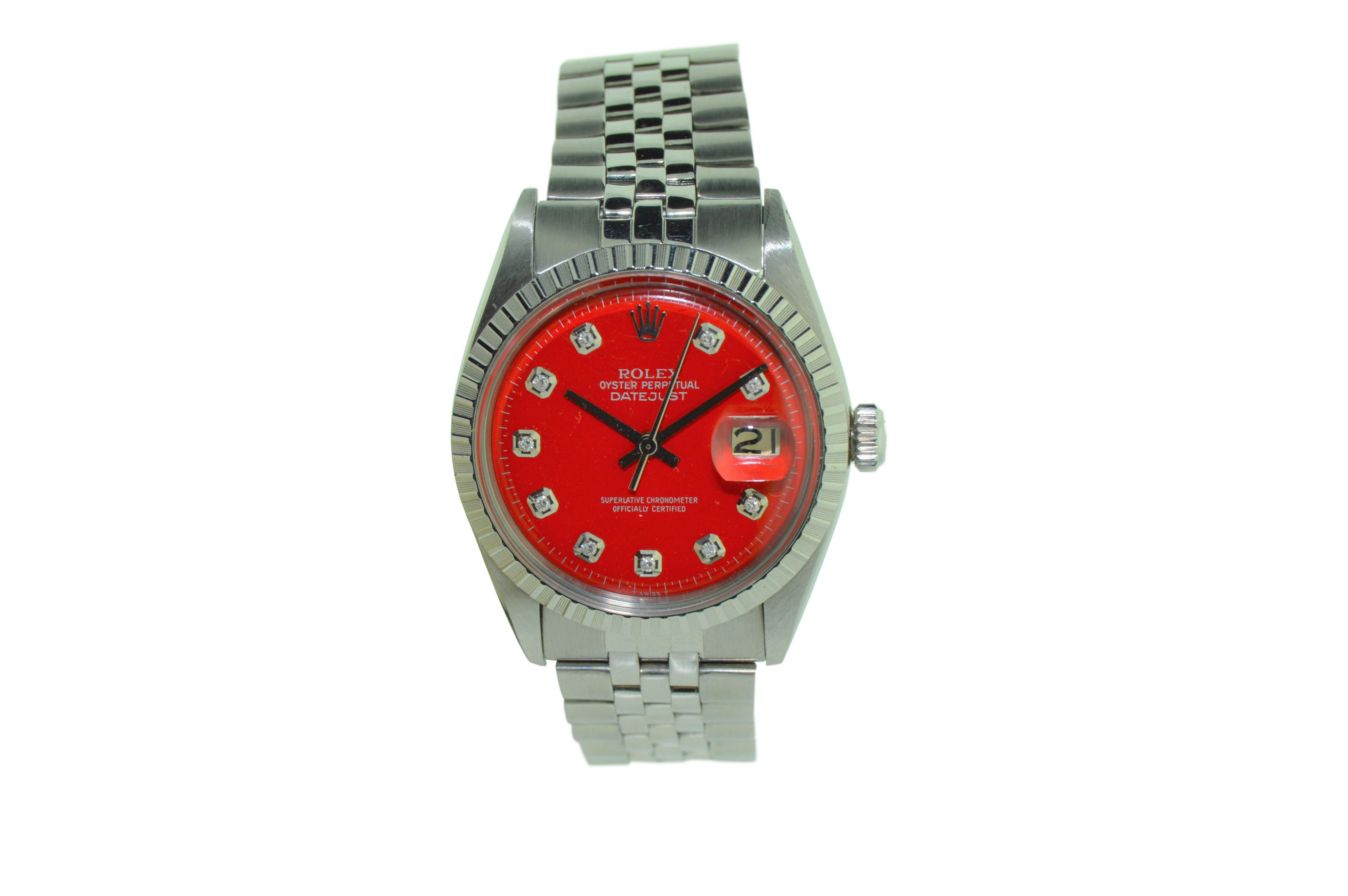FACTORY / HOUSE: Rolex Watch Company
STYLE / REFERENCE: Datejust / 1603
METAL / MATERIAL: Stainless Steel 
DIMENSIONS:  43mm  X  36mm
CIRCA: 1977
MOVEMENT / CALIBER: 1570 / 26 Jewels / Perpetual Winding
DIAL / HANDS: Custom Red Diamond Dial / Baton